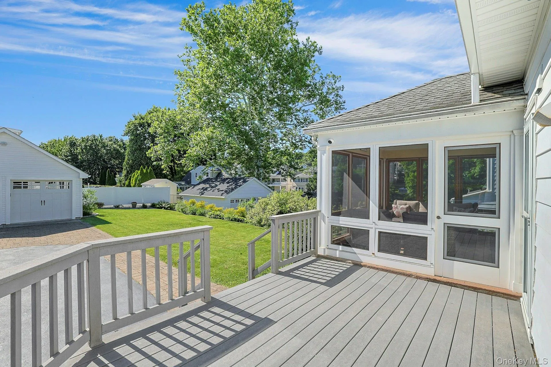 Composite deck with door to enclosed porch and a door to mudroom/kitchen Composite deck with door to enclosed porch and a door to mudroom/kitchen