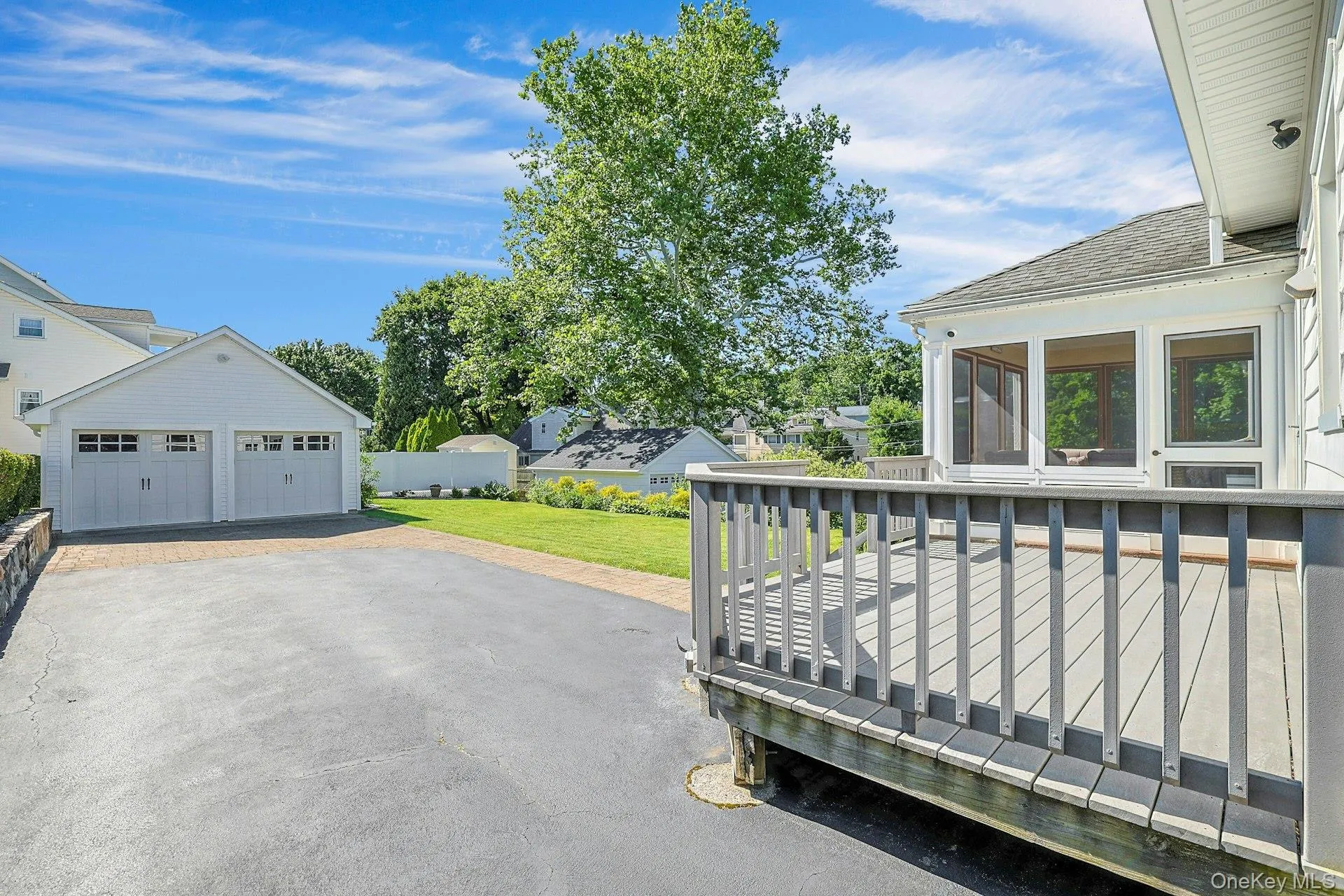 Long level driveway with 2 car garage Long level driveway with 2 car garage