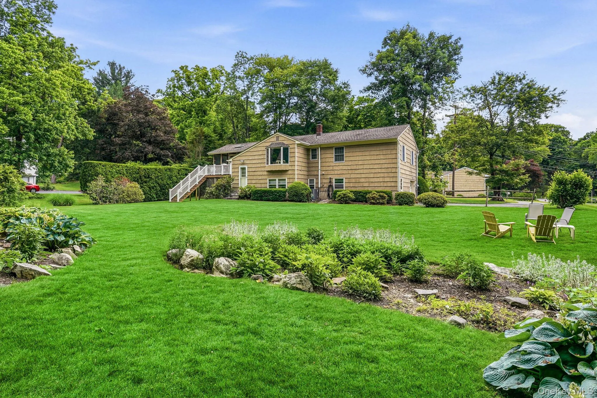 Beautiful back yard lush lawn and perennial plantings Beautiful back yard lush lawn and perennial plantings