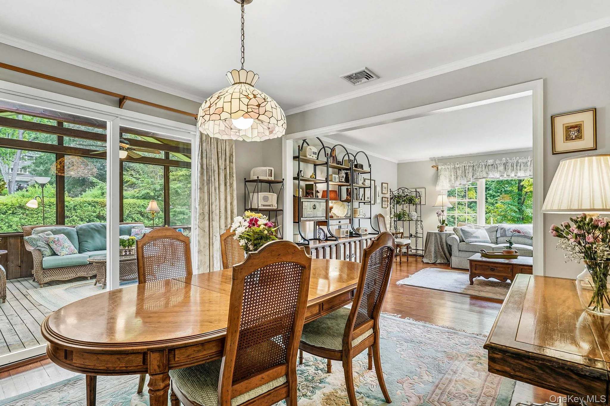 Dining Room with sliding glass door to Adirondack style screened porch Dining Room with sliding glass door to Adirondack style screened porch