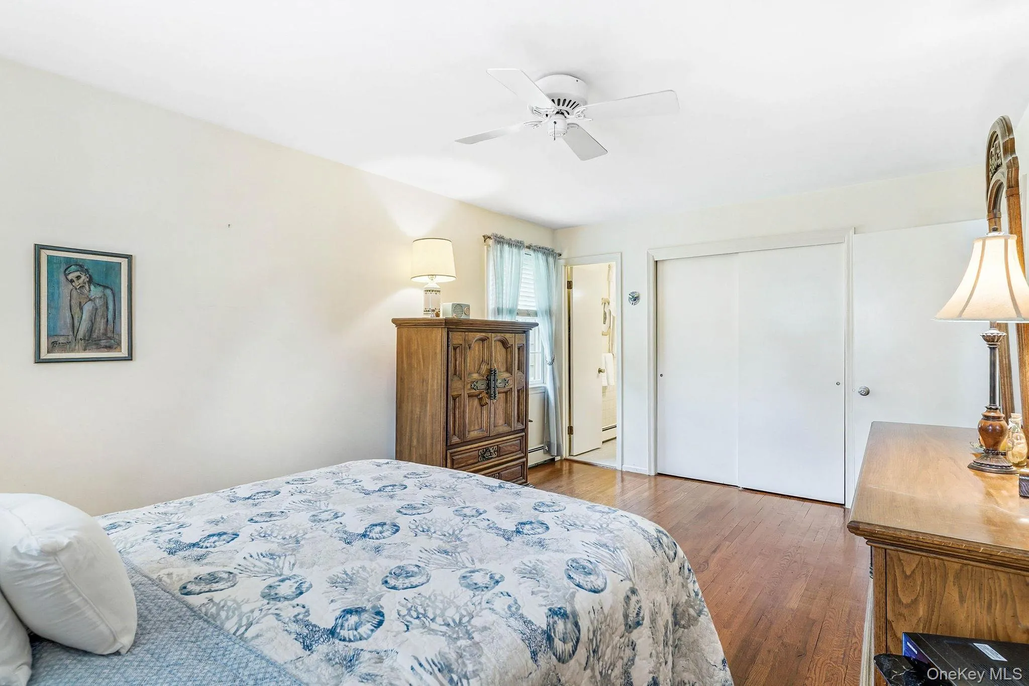 Primary bedroom with attached half bath Primary bedroom with attached half bath