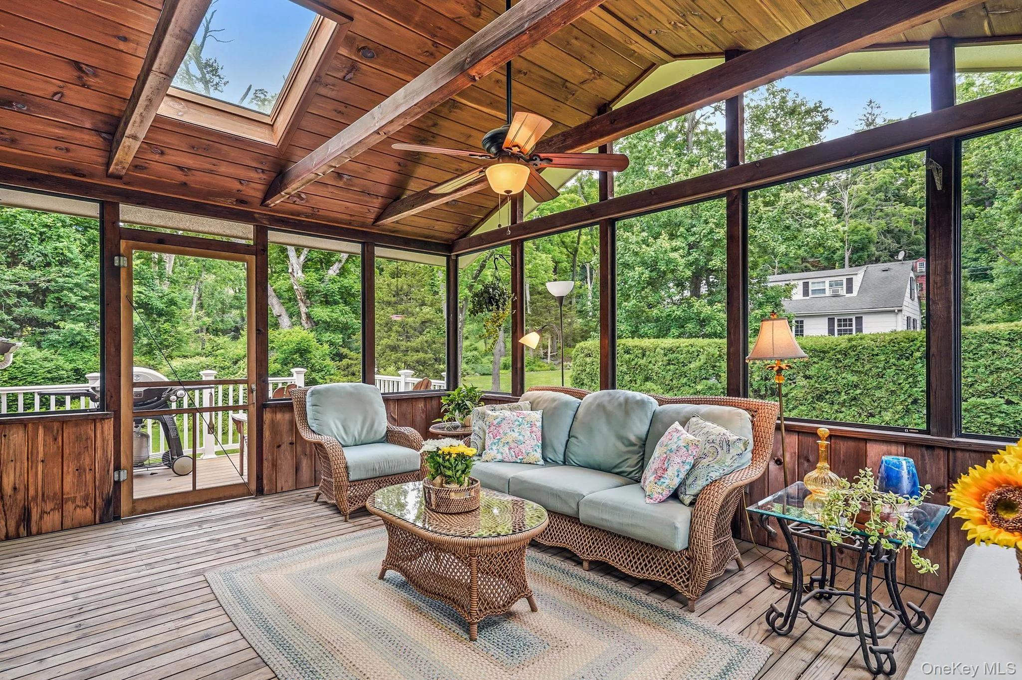 Access to back deck with stairs to private back yard with beautiful perennial plantings and lush lawn. Access to back deck with stairs to private back yard with beautiful perennial plantings and lush lawn.