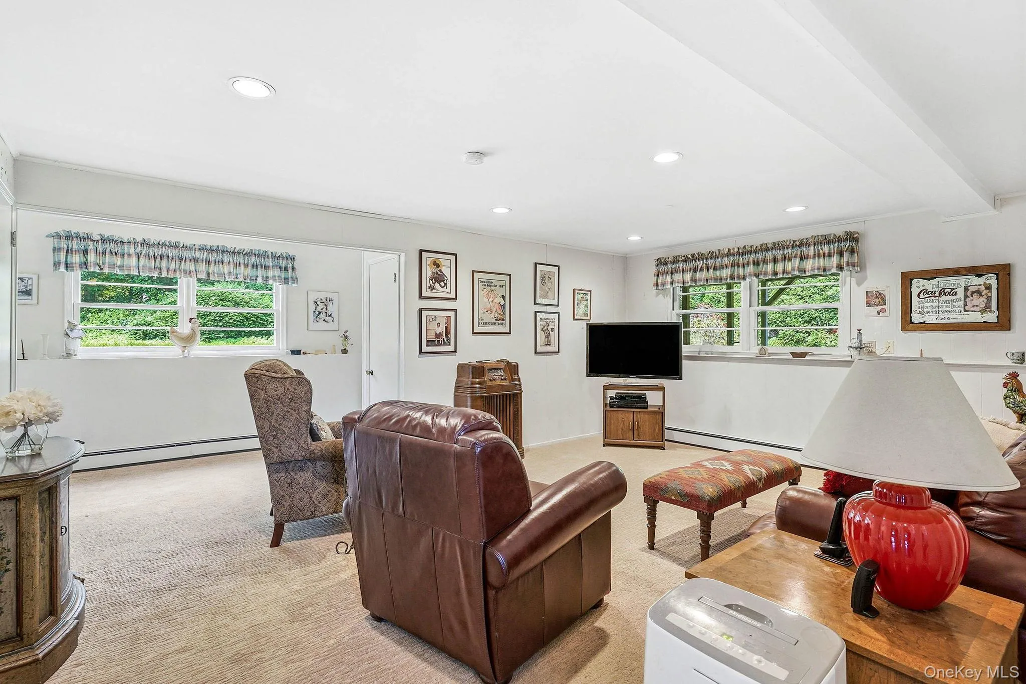 Lower level family room with access to back stairs to pantry level , door to yard and kitchen access Lower level family room with access to back stairs to pantry level , door to yard and kitchen access