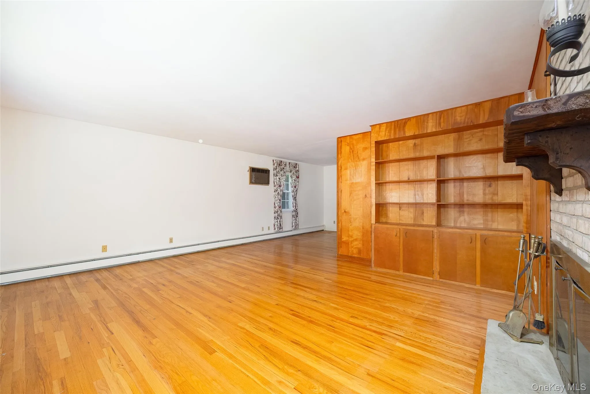 Beautiful hardwood floors, custom built-ins, and a cozy fireplace Beautiful hardwood floors, custom built-ins, and a cozy fireplace