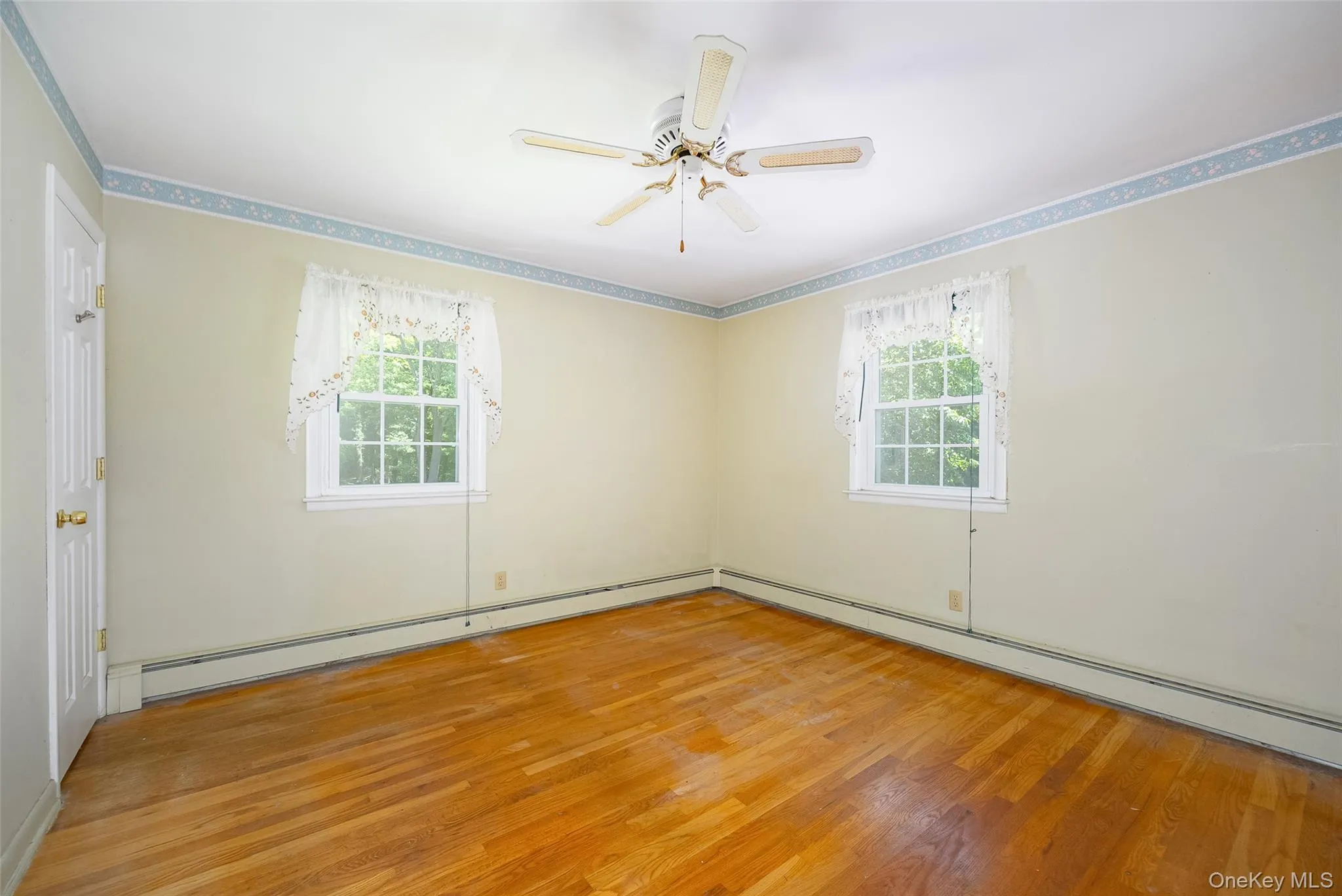 Large primary bedroom with a private half-bath en suite Large primary bedroom with a private half-bath en suite