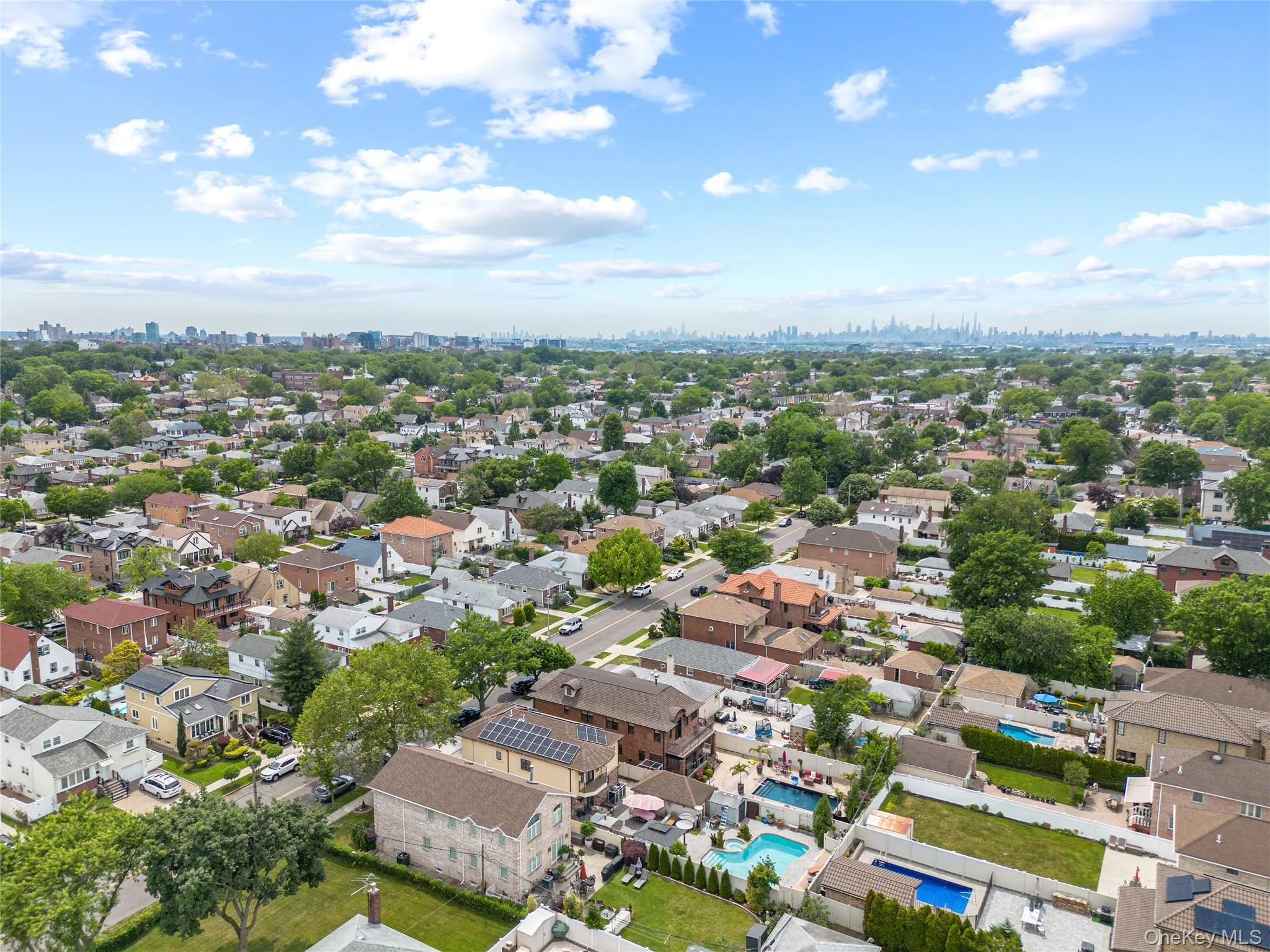 Expansive residential area featuring a variety of homes, mature trees, and visible street infrastructure Expansive residential area featuring a variety of homes, mature trees, and visible street infrastructure