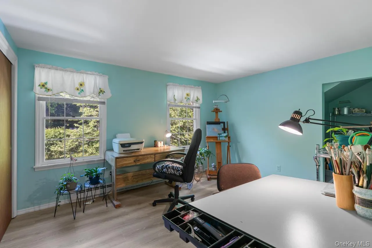 This bedroom is currently being used as an art studio This bedroom is currently being used as an art studio