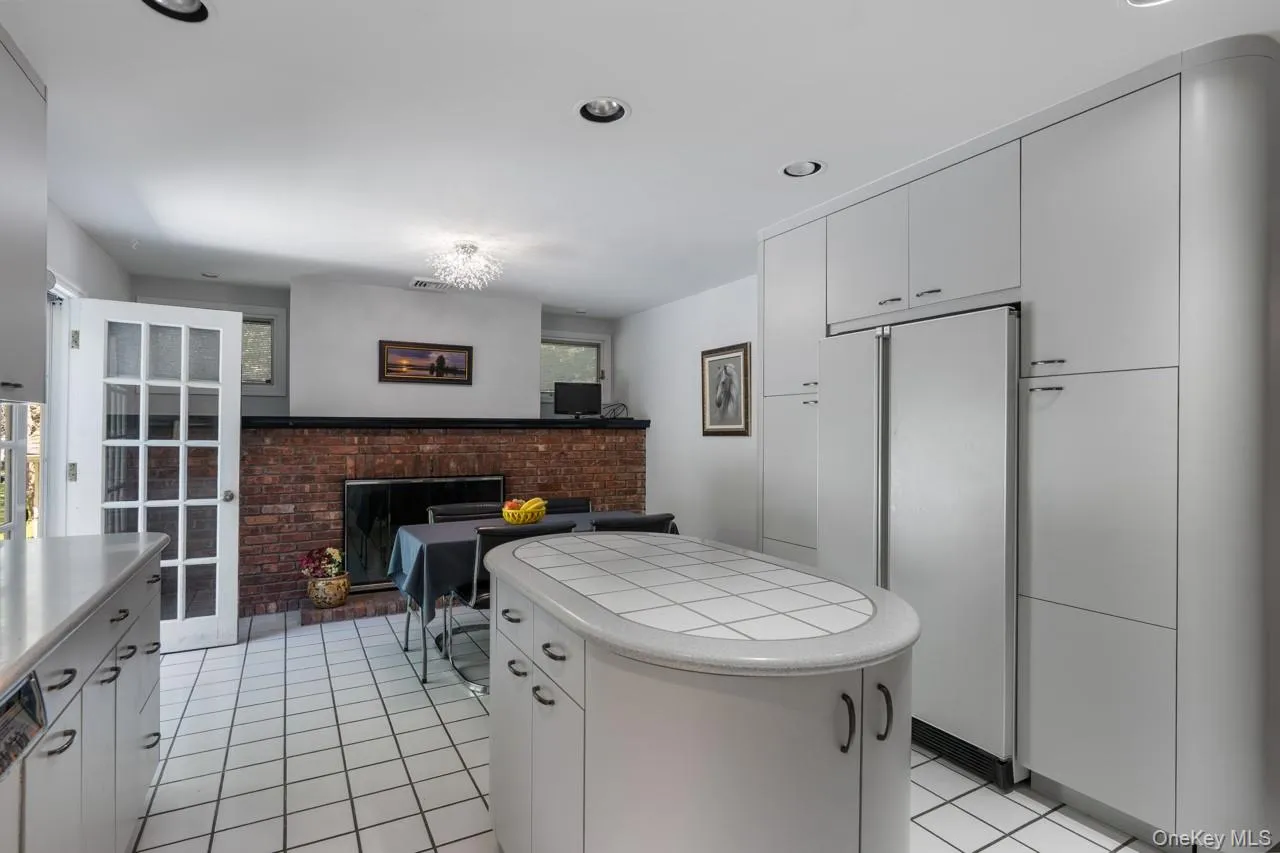 Brick, wood-burning fireplace in the eat-in area of the kitchen Brick, wood-burning fireplace in the eat-in area of the kitchen