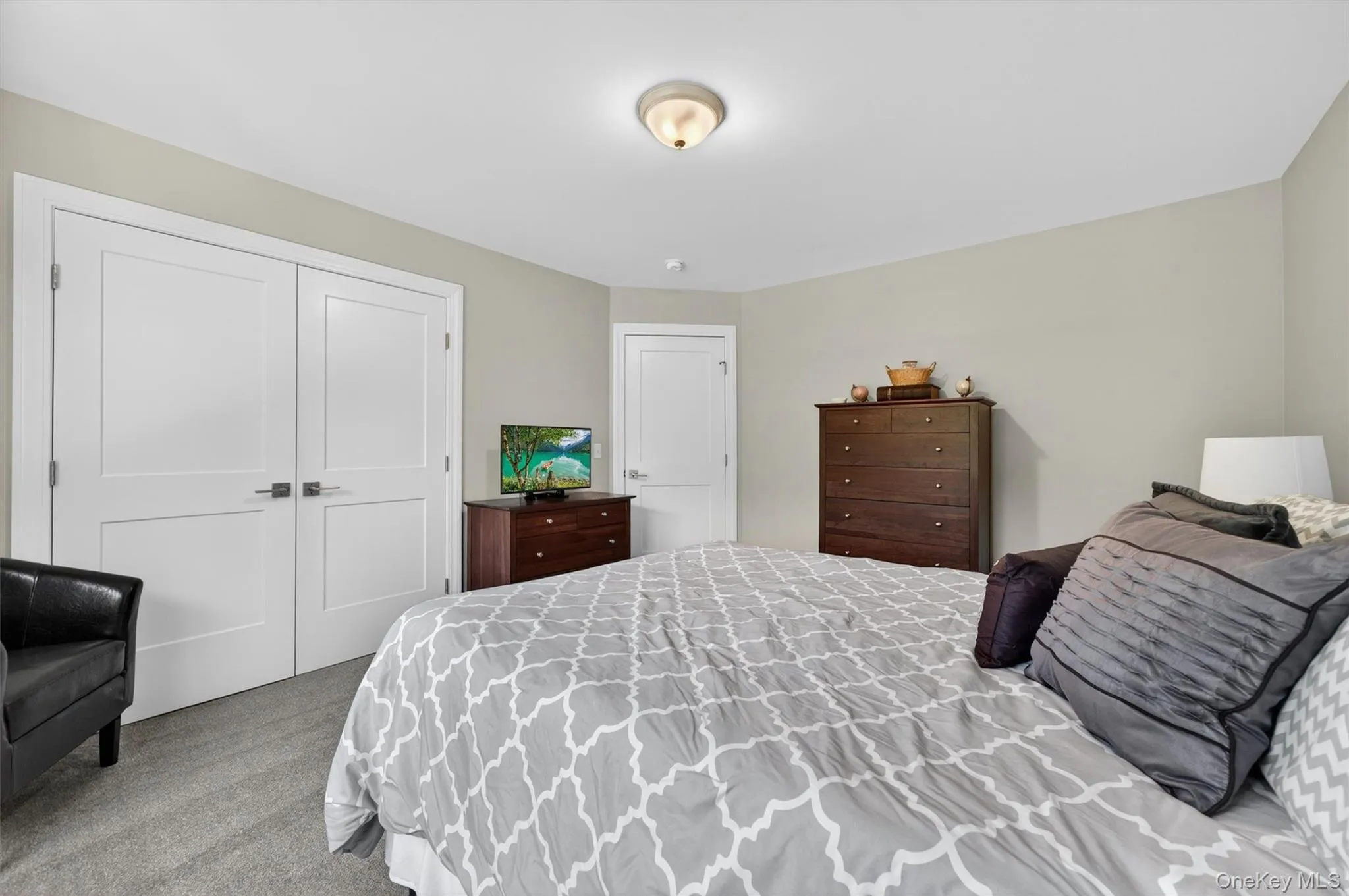 Neutral wall paint, white trim, and a flush mount ceiling light Neutral wall paint, white trim, and a flush mount ceiling light