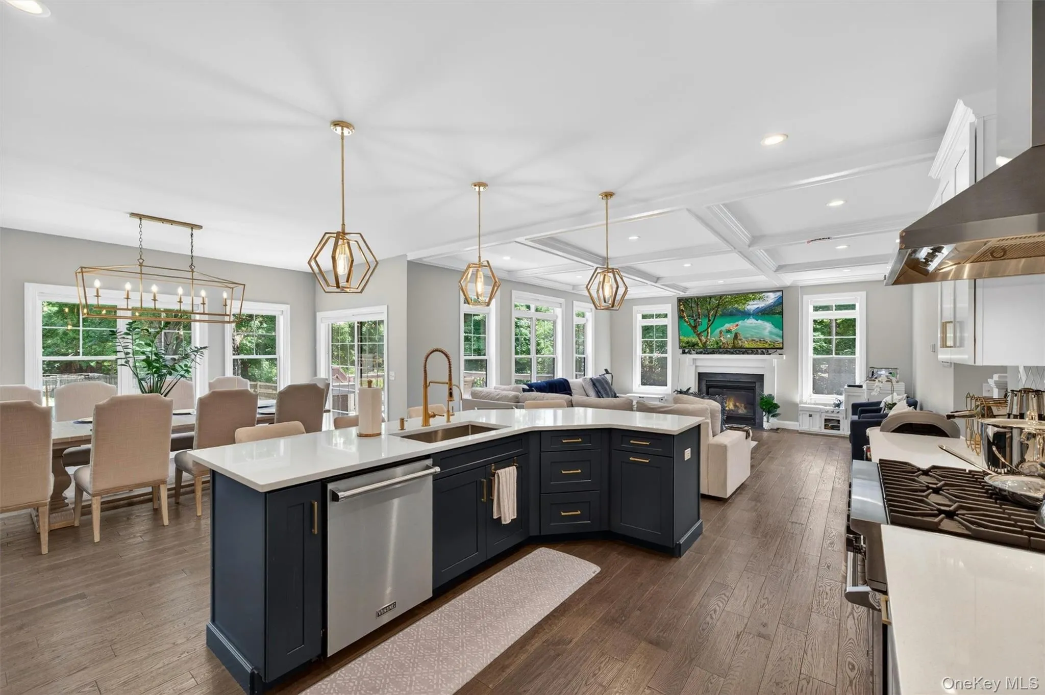 Open-concept interior featuring dark wood-finish flooring throughout Open-concept interior featuring dark wood-finish flooring throughout