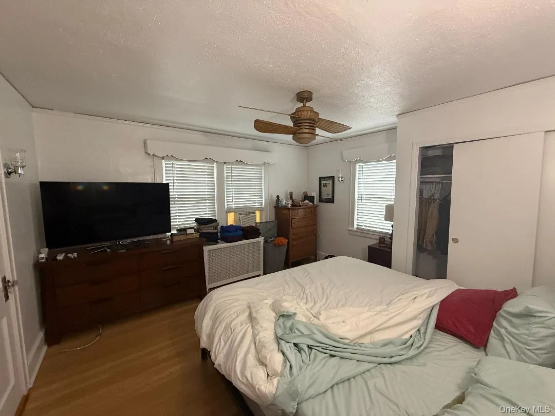 Large primary bedroom with walk up stairs to attic for storage Large primary bedroom with walk up stairs to attic for storage