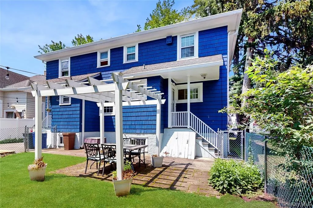 Shared patio and rear yard with back door entrance Shared patio and rear yard with back door entrance