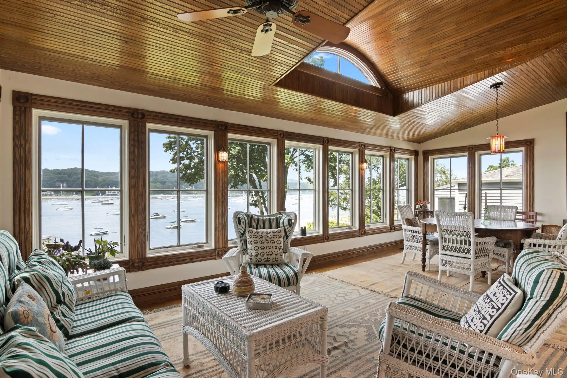 Bright and airy sunroom designed for waterfront living Bright and airy sunroom designed for waterfront living