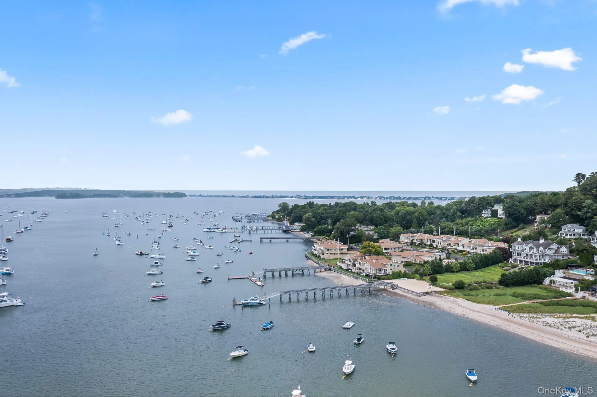Aerial view highlighting the home's premier waterfront location Aerial view highlighting the home's premier waterfront location