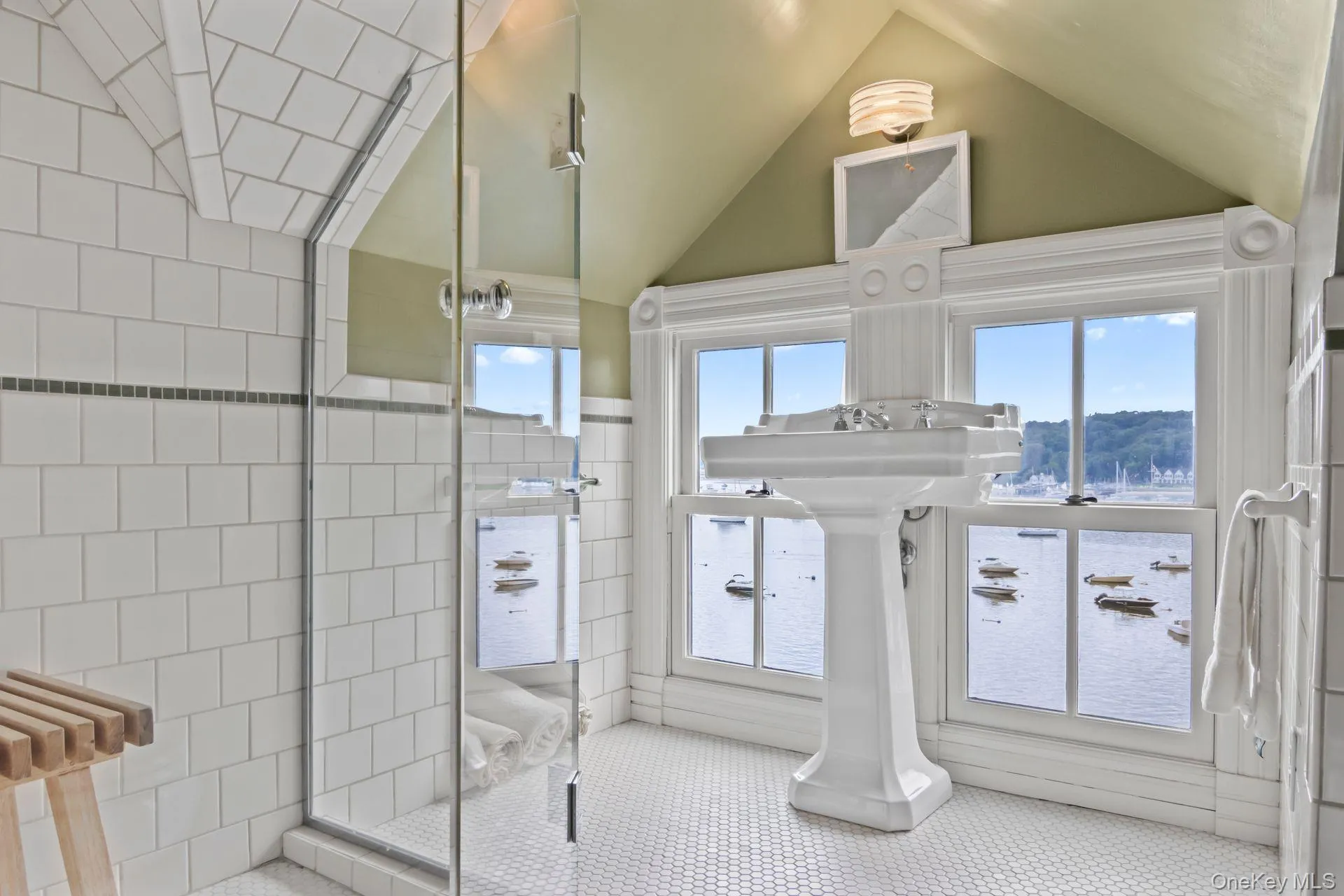 Waterfront full bath featuring stunning harbor views Waterfront full bath featuring stunning harbor views