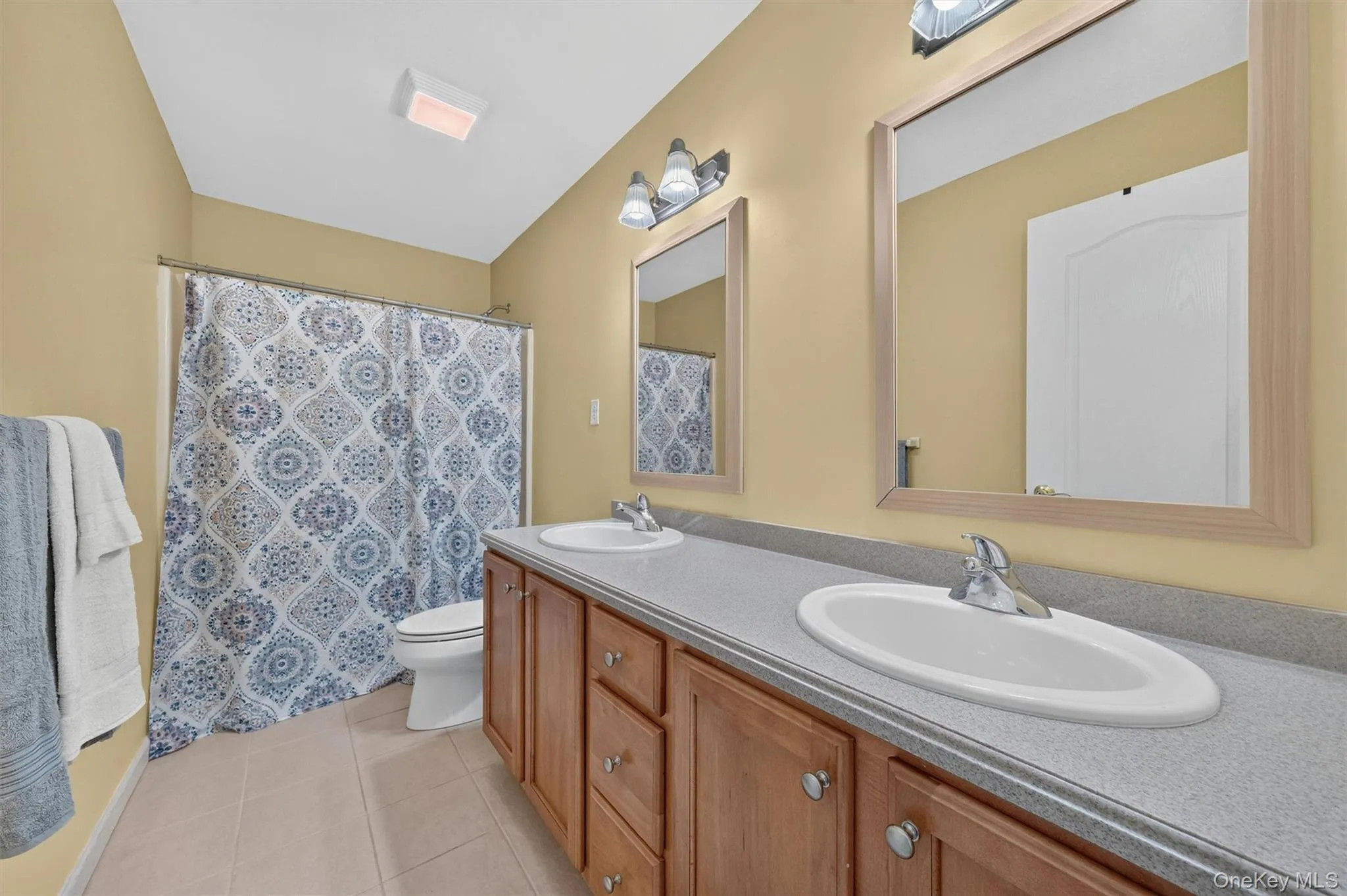 Full bathroom and shower with double vanity on the second floor Full bathroom and shower with double vanity on the second floor
