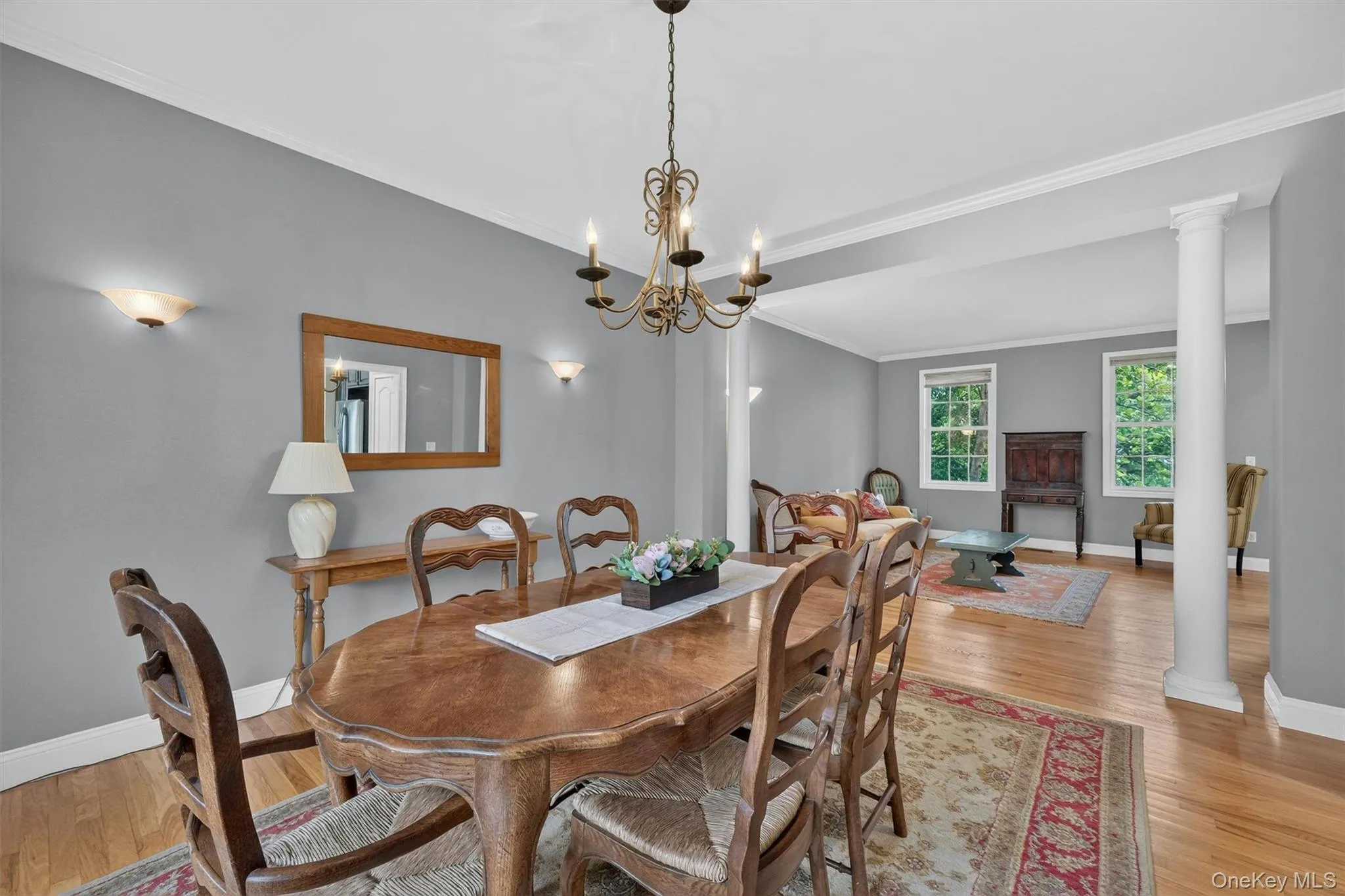 Spacious dining room with white columns to compliment the two rooms Spacious dining room with white columns to compliment the two rooms