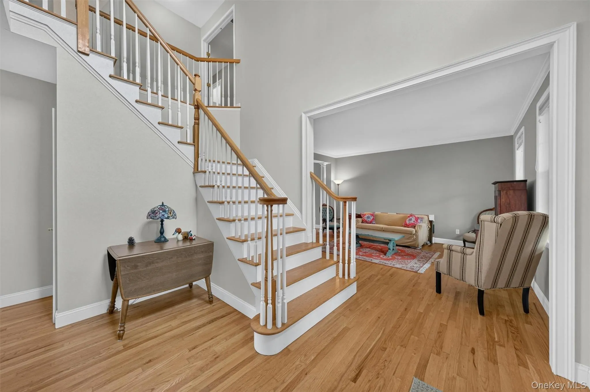 Open entry with a den on the left and a living room on your right Open entry with a den on the left and a living room on your right