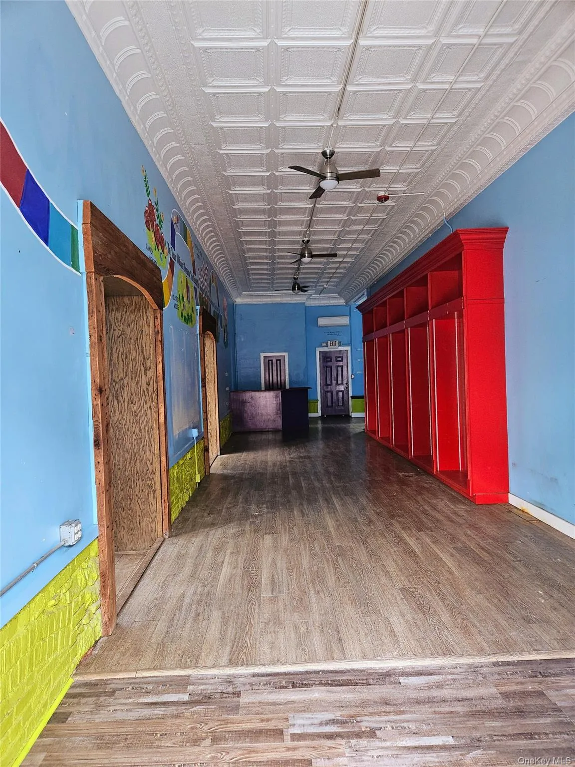 Showroom as you enter from Main Street, looking toward the rear of space. It's approximately 573 sf from the front door and another approximately 120 sf at the end and to the right (not seen in this photo). Showroom as you enter from Main Street, looking toward the rear of space. It's approximately 573 sf from the front door and another approximately 120 sf at the end and to the right (not seen in this photo).
