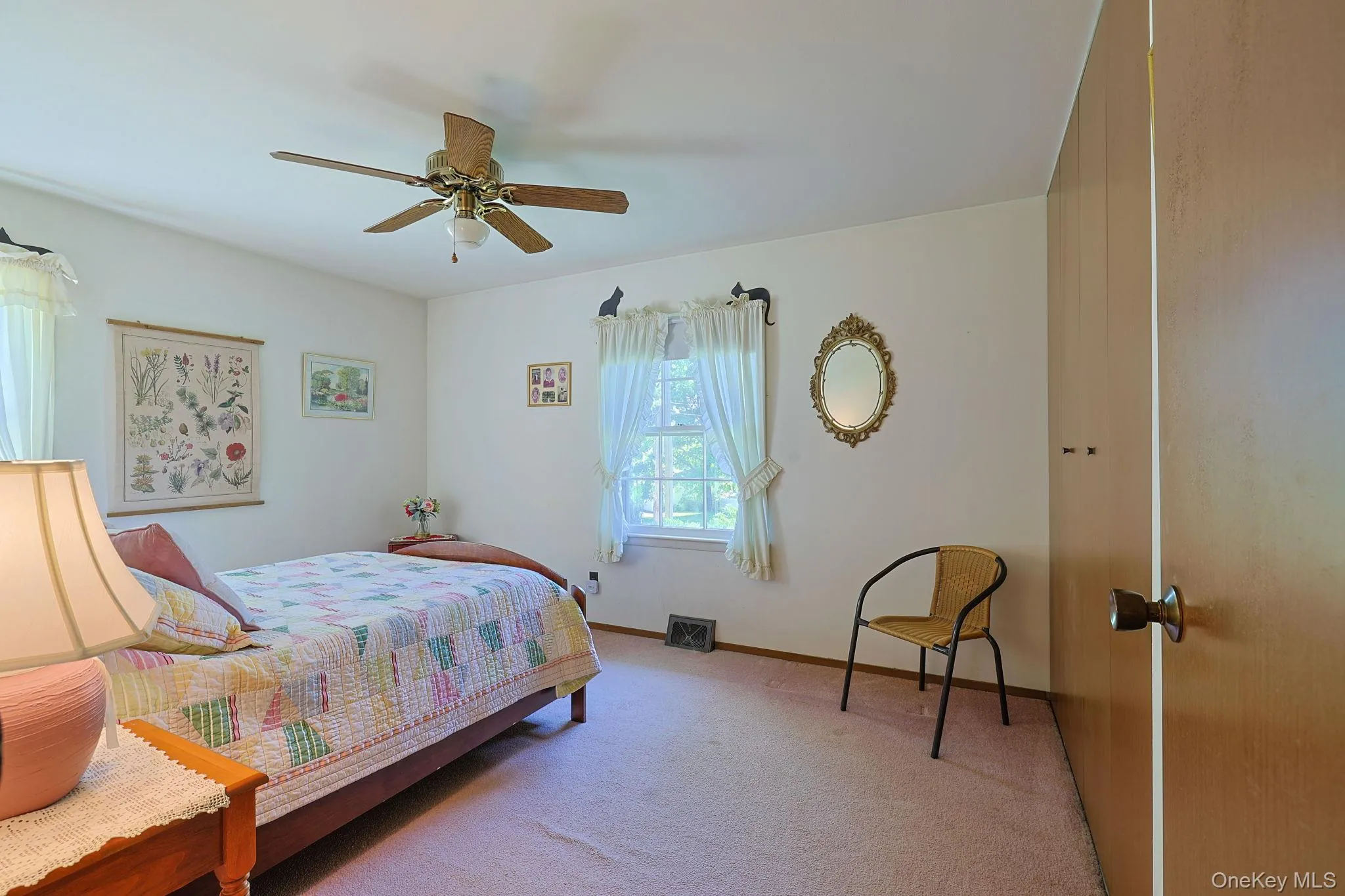 This ample size bedroom has two windows, a ceiling fan with light fixture, and has carpeting. This ample size bedroom has two windows, a ceiling fan with light fixture, and has carpeting.