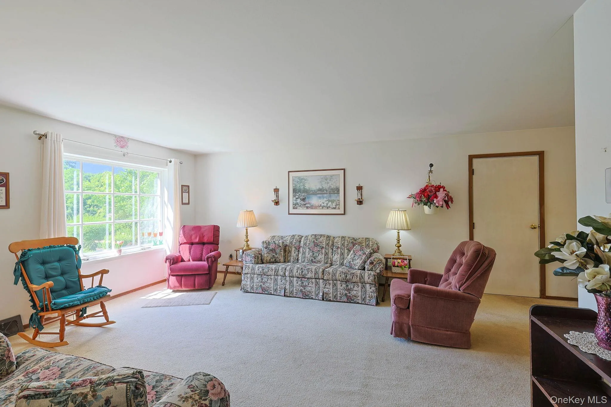 The bright and open living room is ready for entertaining. The bright and open living room is ready for entertaining.