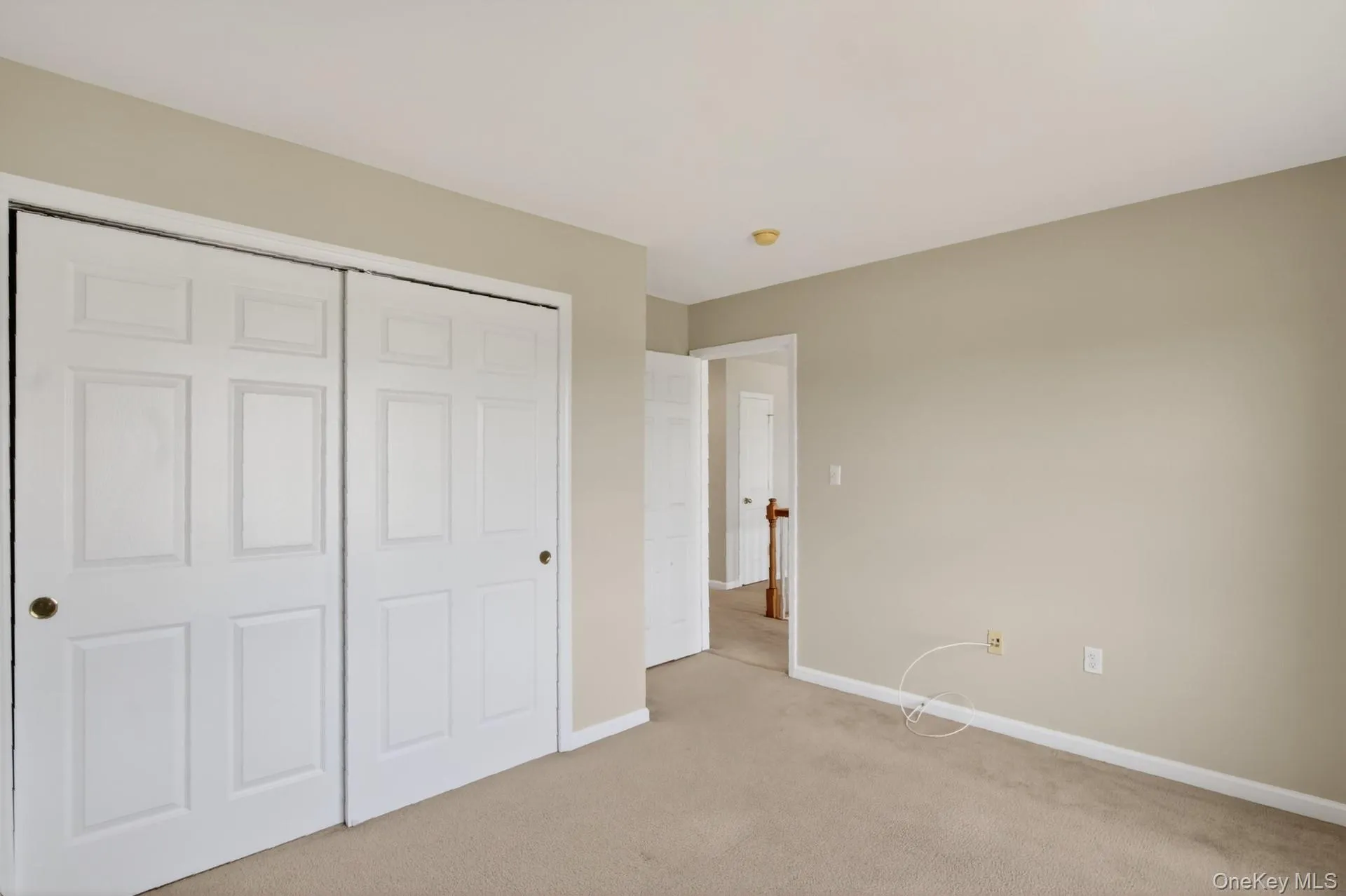 Neutral-toned wall paint and beige carpeting Neutral-toned wall paint and beige carpeting