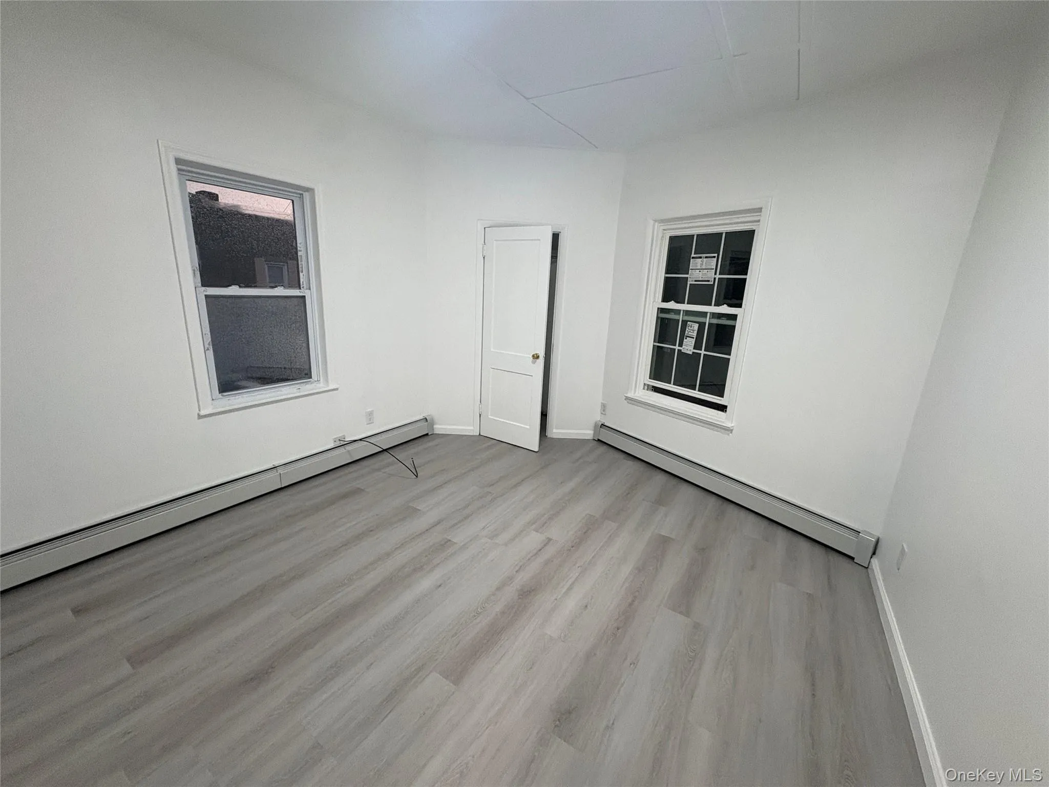 Bright bedroom with updated flooring, fresh finishes, and ample space for furnishings. Bright bedroom with updated flooring, fresh finishes, and ample space for furnishings.