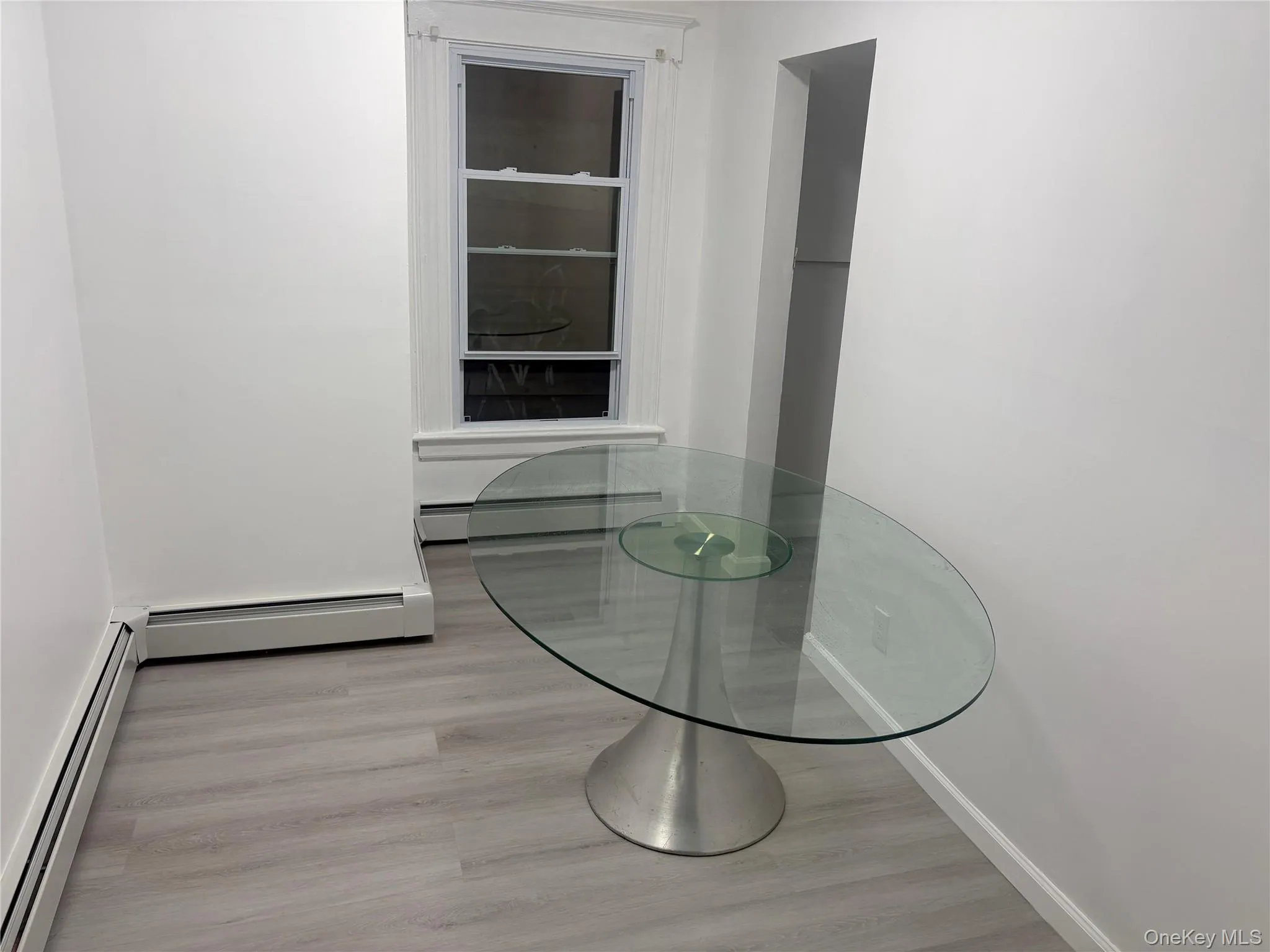 Bright dining area with modern flooring and ample space for everyday dining and entertaining. Bright dining area with modern flooring and ample space for everyday dining and entertaining.