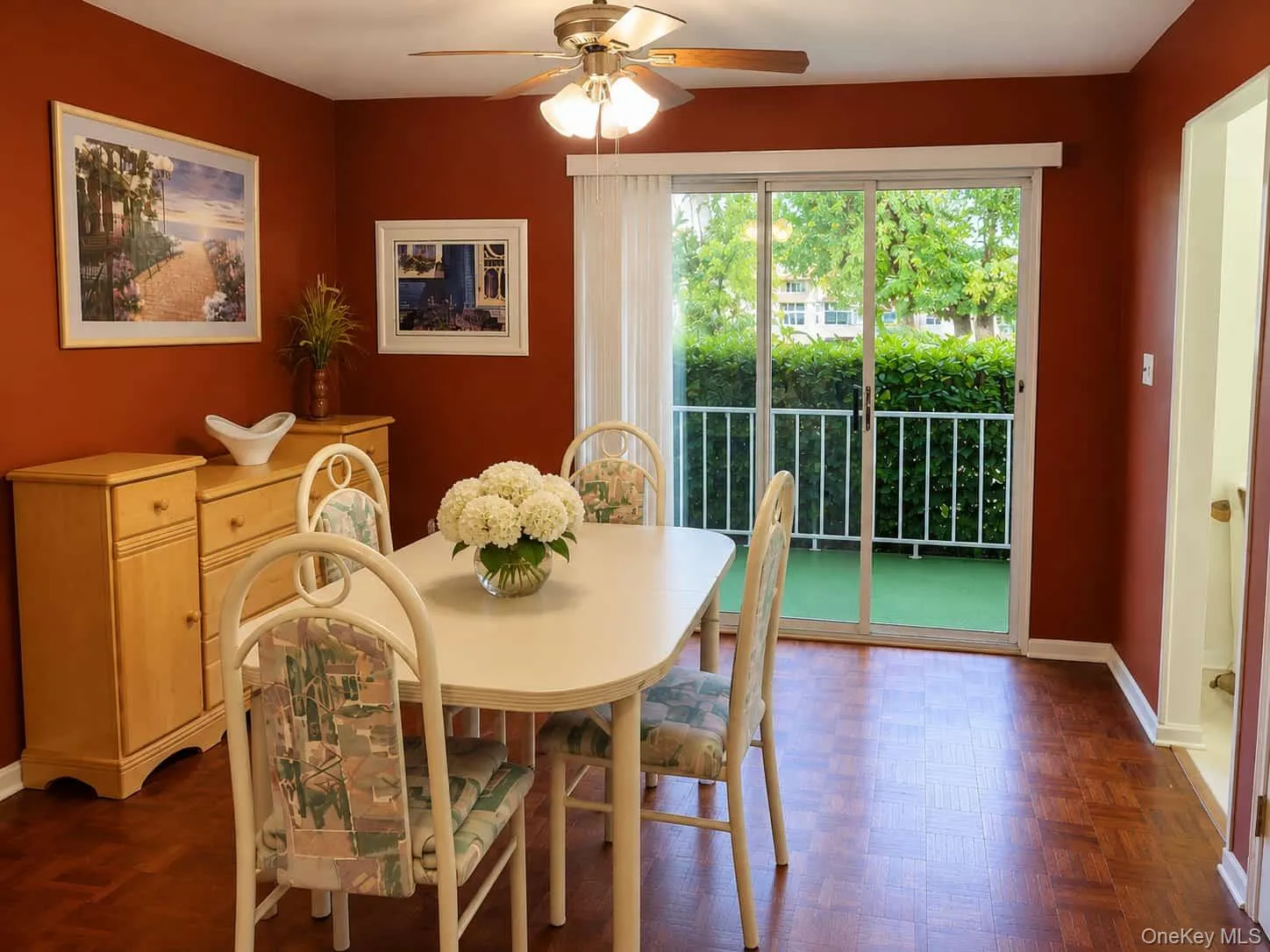 Dining room with entry to kitchen and sliding doors out to the balcony Dining room with entry to kitchen and sliding doors out to the balcony