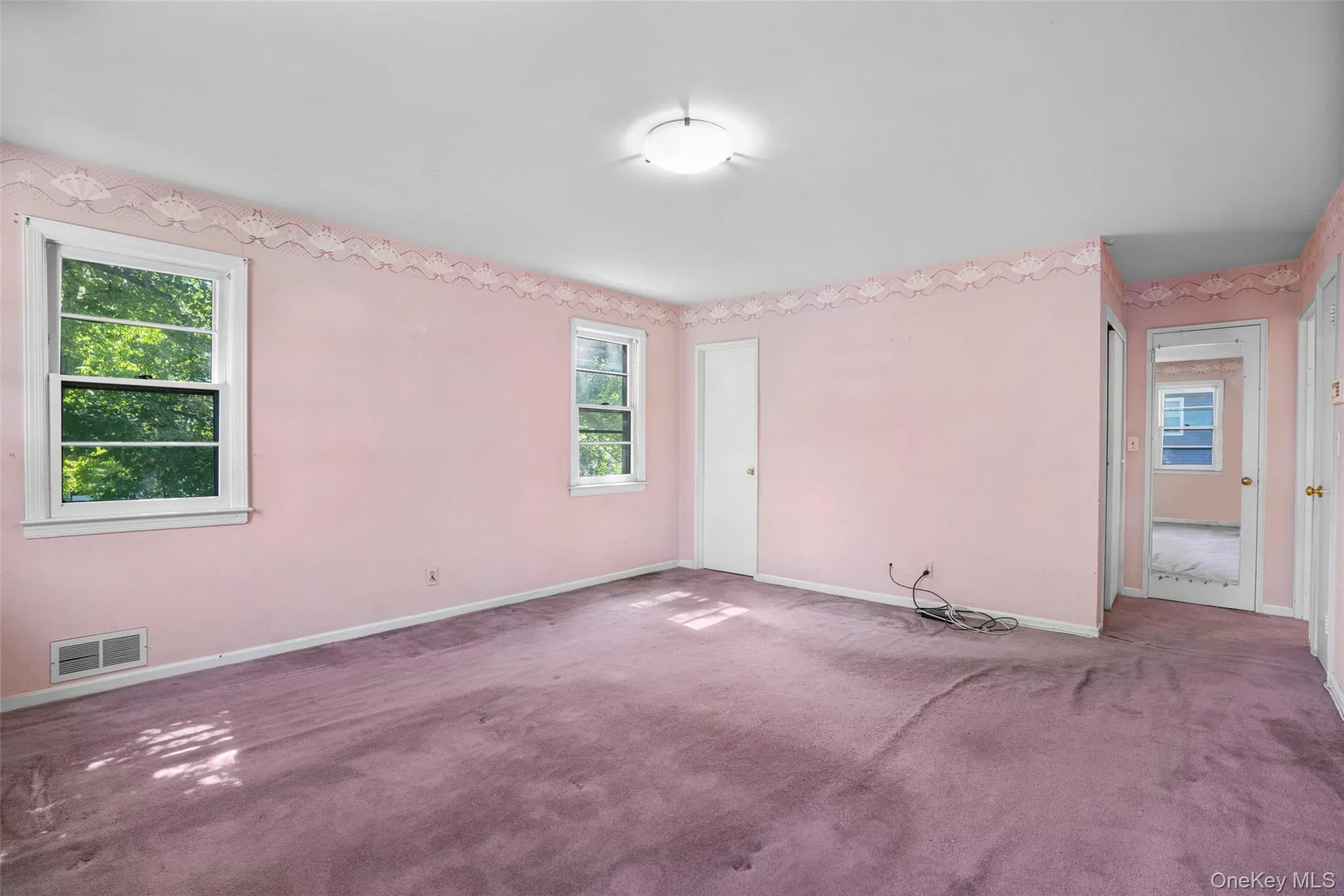 Opposite View of Master bedroom shows door to Bathroom and its 3 Closets on right. Opposite View of Master bedroom shows door to Bathroom and its 3 Closets on right.