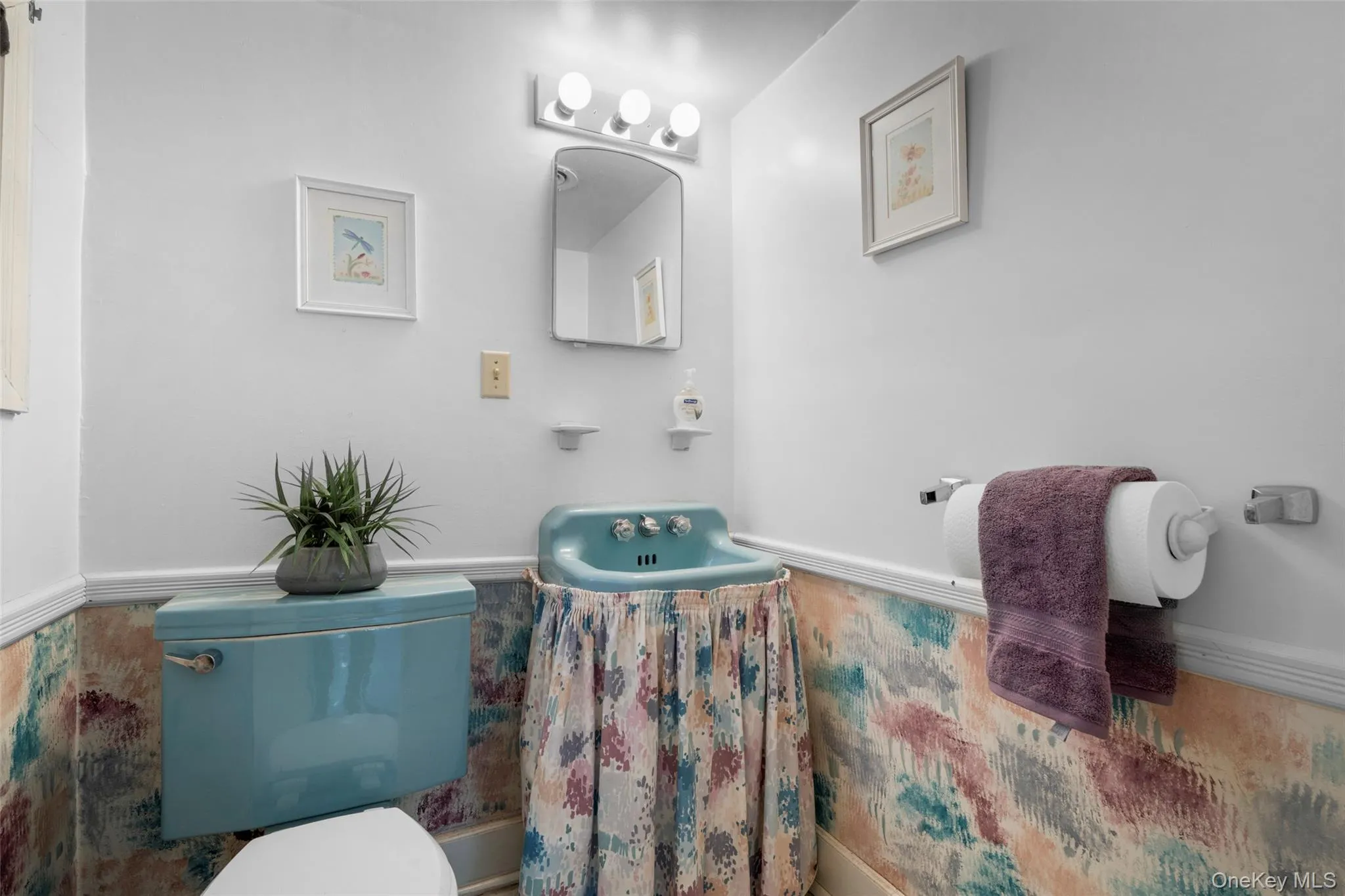 Charming 50s Powder room off Family room features a window. Charming 50s Powder room off Family room features a window.