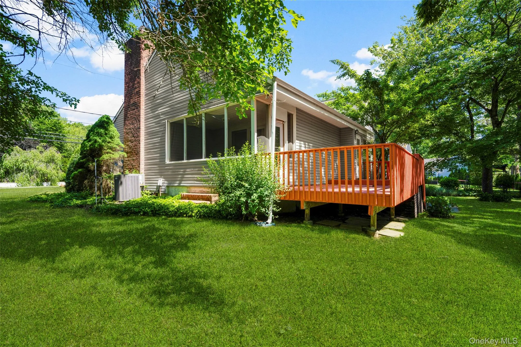 View of Enclosed Screened Porch with access to Deck as well as patio and backyard. View of Enclosed Screened Porch with access to Deck as well as patio and backyard.