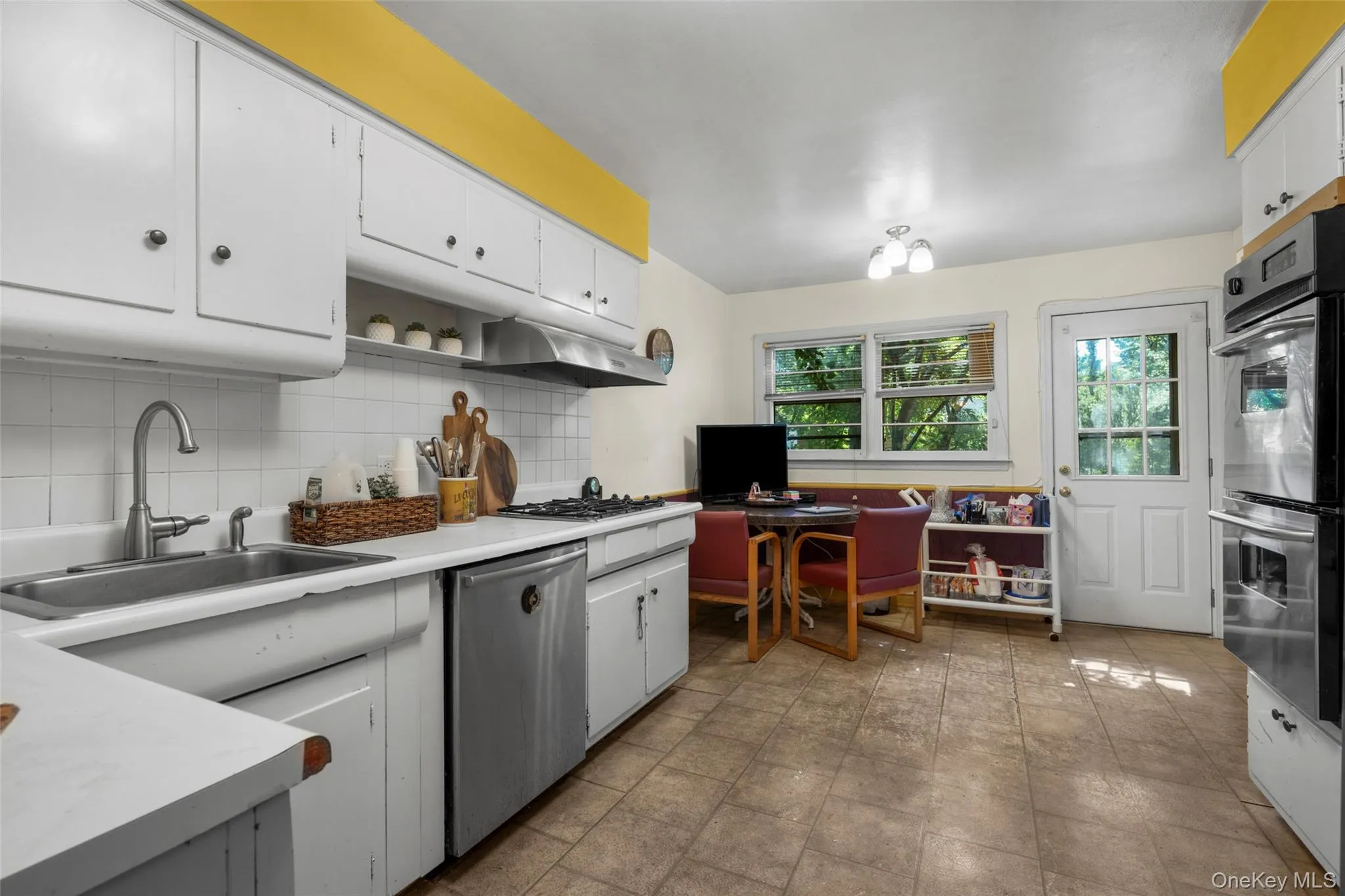 Eat-in-Kitchen has door out to Deck with stairs to Patio and Backyard. Eat-in-Kitchen has door out to Deck with stairs to Patio and Backyard.