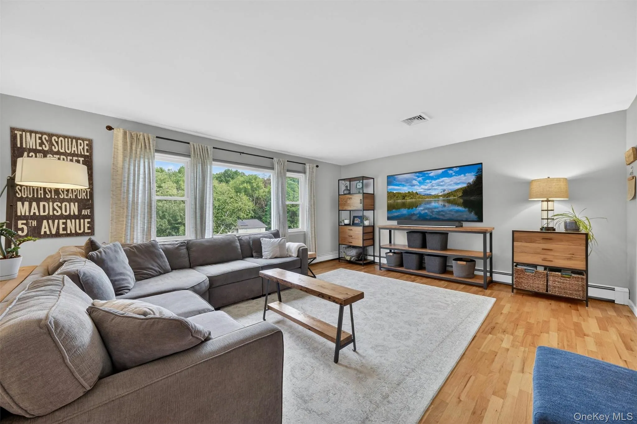 The oversized picture window fills the living room and dining room with incredible natural light. The oversized picture window fills the living room and dining room with incredible natural light.