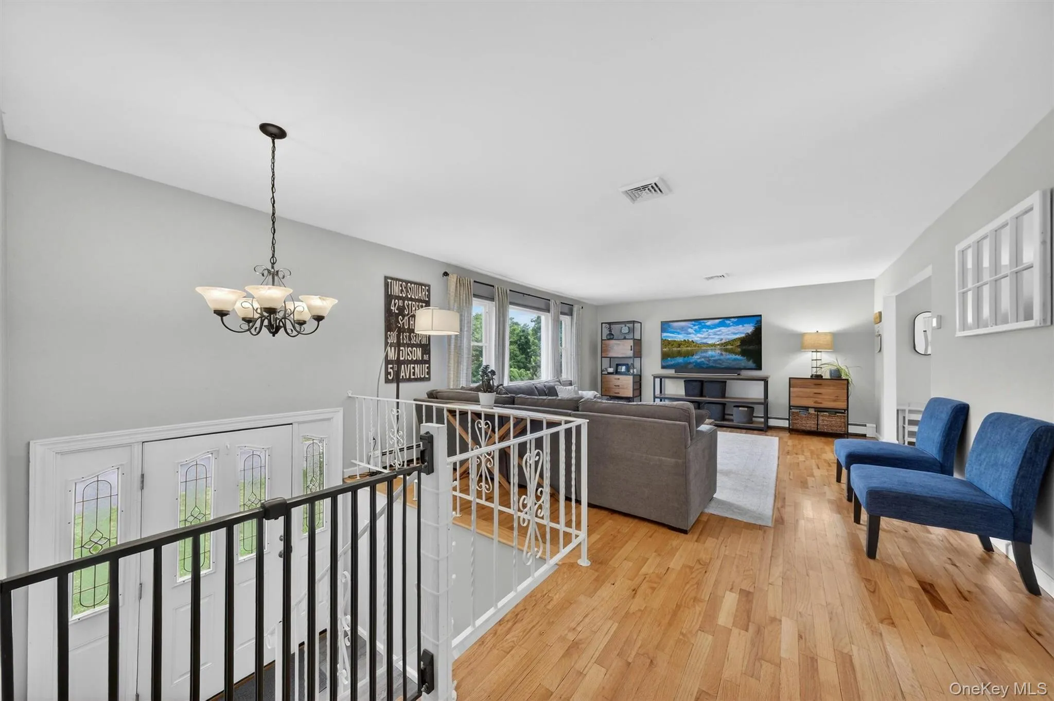 Entry foyer leads to the sun filled main living area. Hardwood flooring accents the upper level of this home. Entry foyer leads to the sun filled main living area. Hardwood flooring accents the upper level of this home.