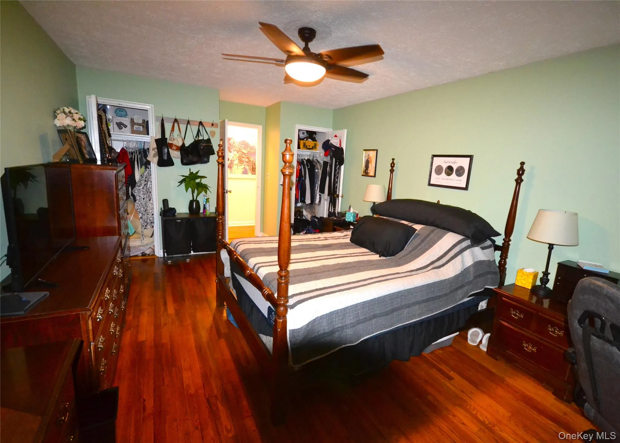 Very ample size bedroom with hardwood floors and twin closets. Very ample size bedroom with hardwood floors and twin closets.