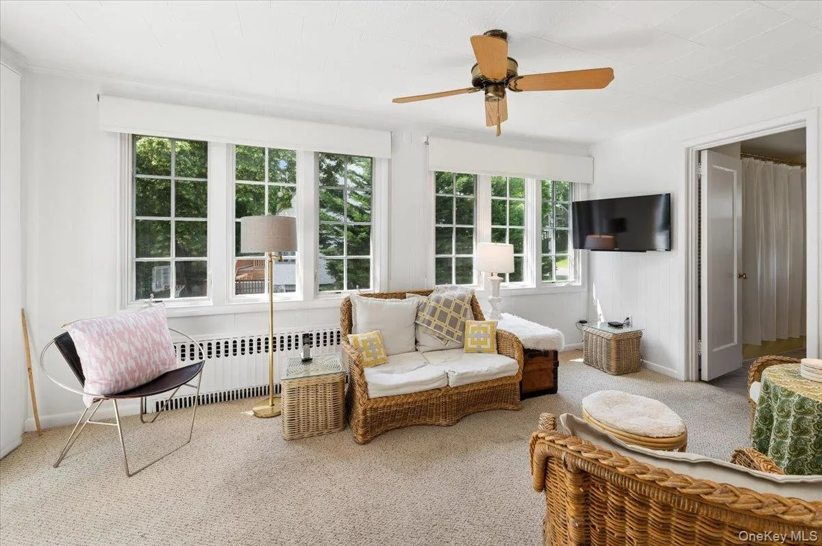 The office/sunroom has a wall of windows and a full bath to double as a guest space. The office/sunroom has a wall of windows and a full bath to double as a guest space.