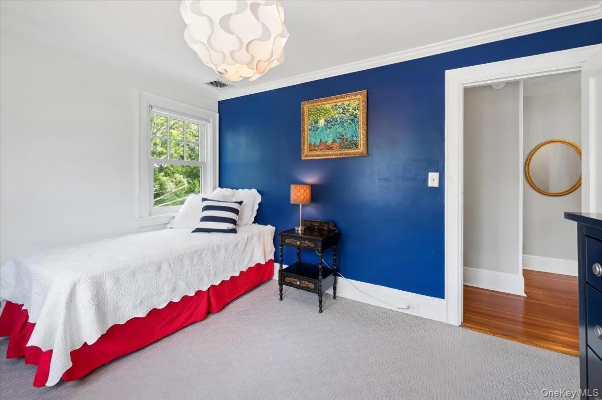 This bedroom overlooks the front yard. This bedroom overlooks the front yard.