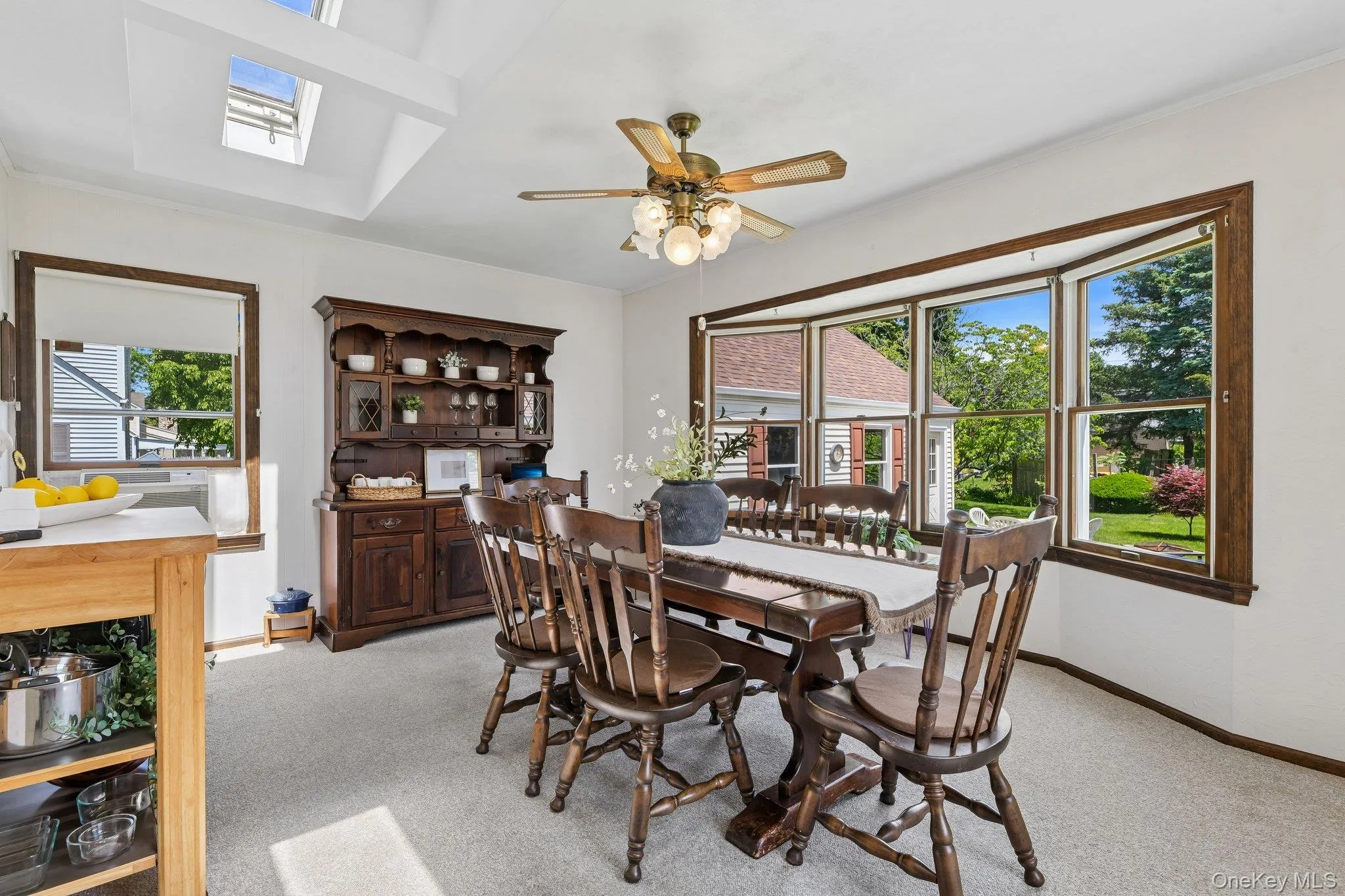 Huge dining room with walls of glass looking out over rear yard. Huge dining room with walls of glass looking out over rear yard.