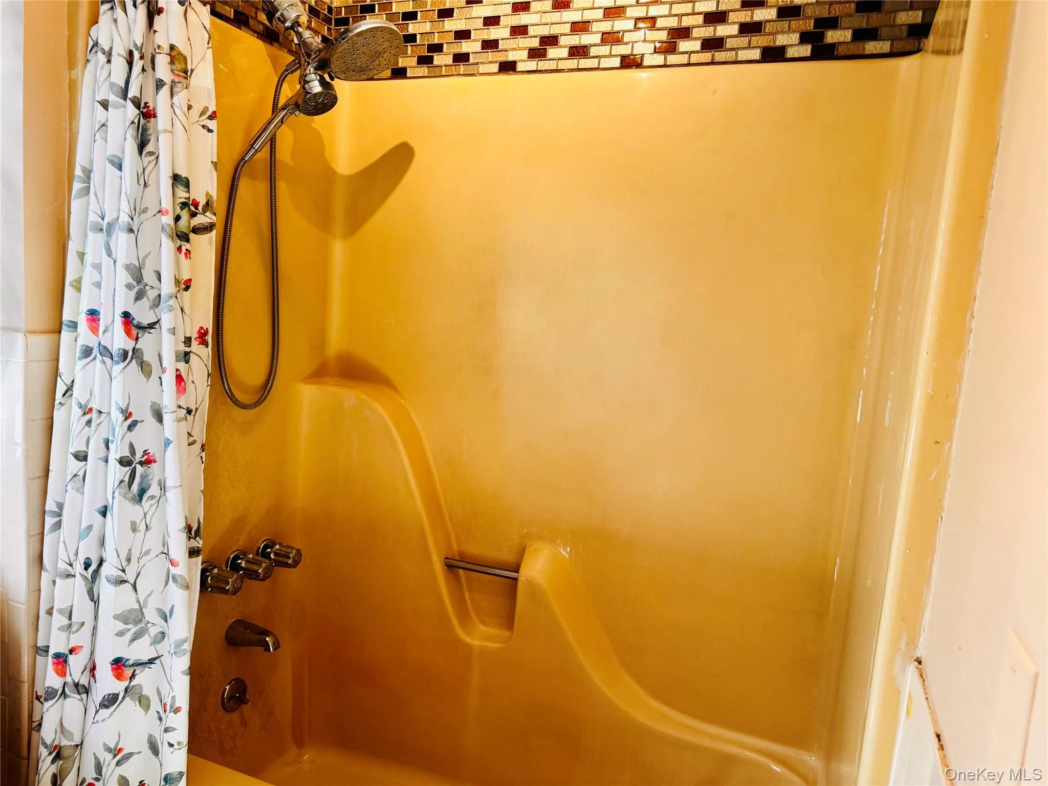 Full bathroom located in hallway. Full bathroom located in hallway.