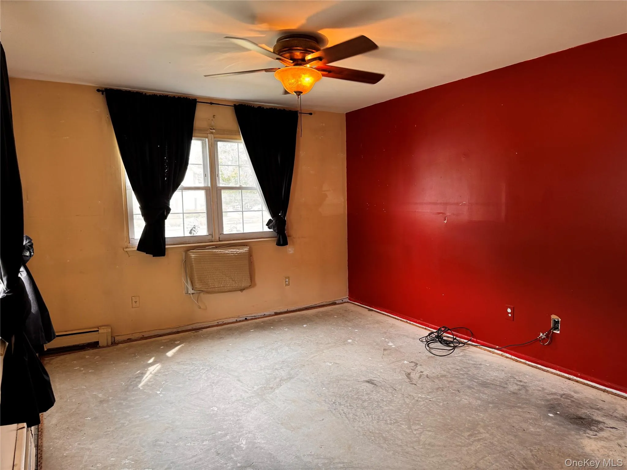Primary Bedroom with air conditioner wall unit Primary Bedroom with air conditioner wall unit
