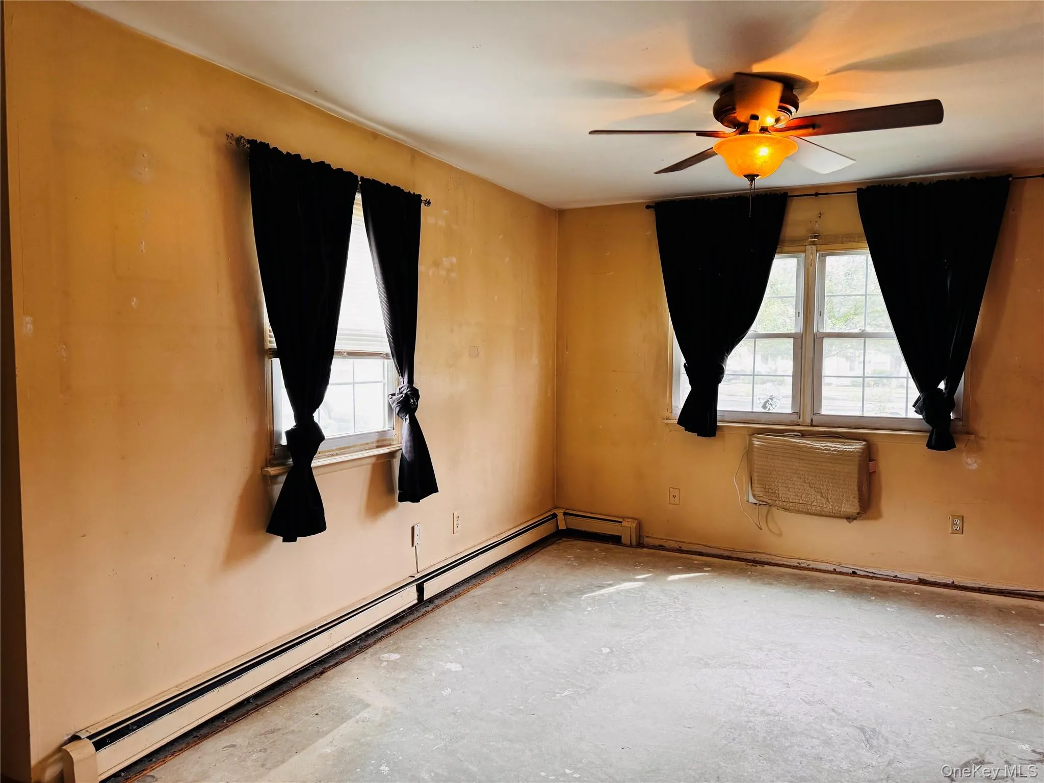 Primary Bedroom with air conditioner wall unit Primary Bedroom with air conditioner wall unit
