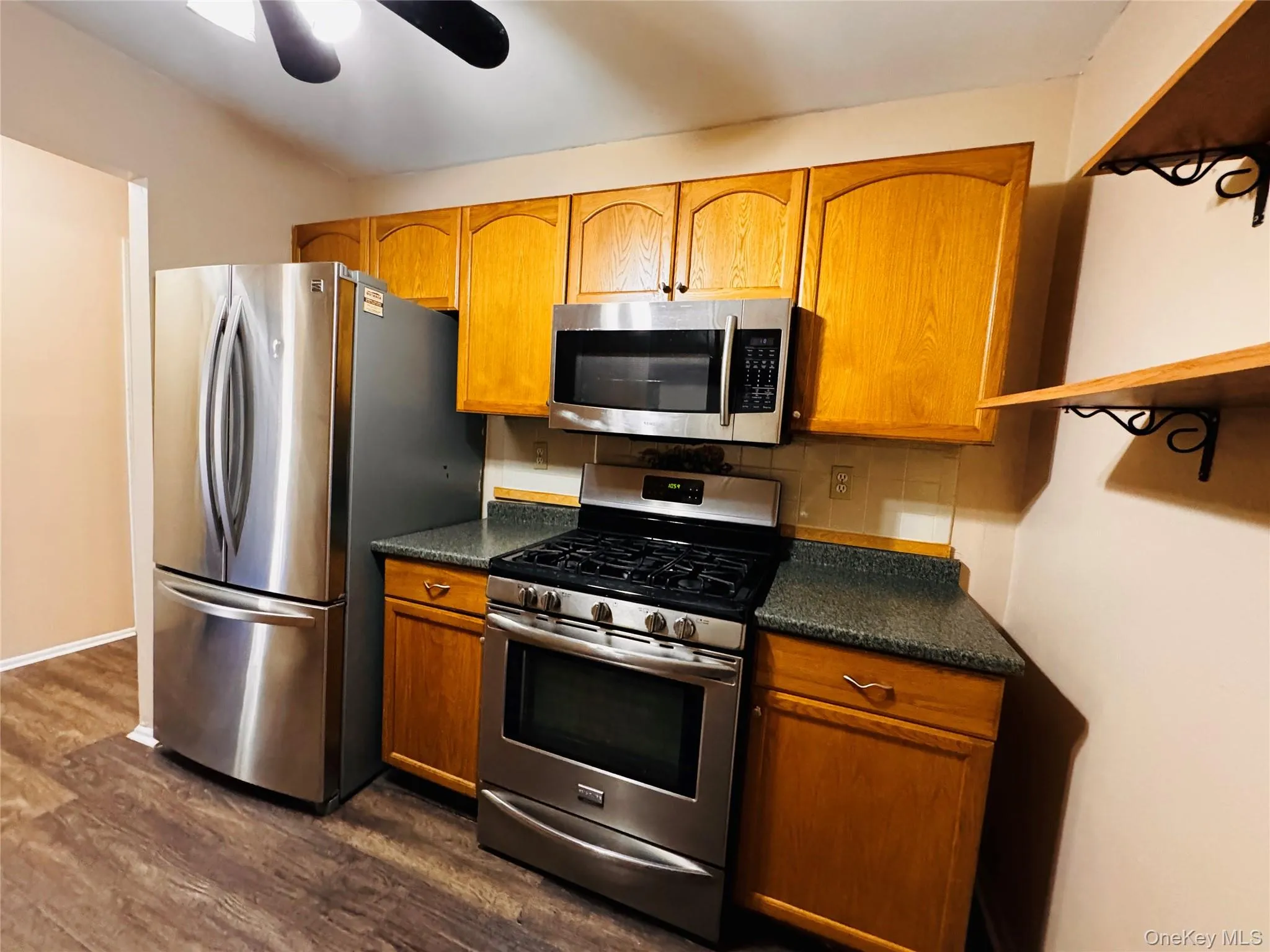 Kitchen with stainless steel appliances. Kitchen with stainless steel appliances.