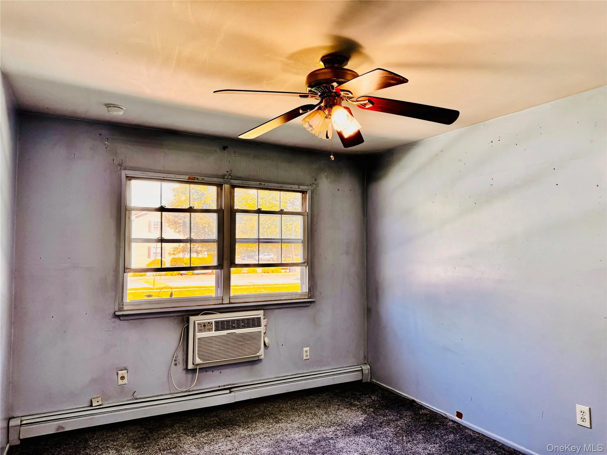 Bedroom with large closet and fan. Bedroom with large closet and fan.