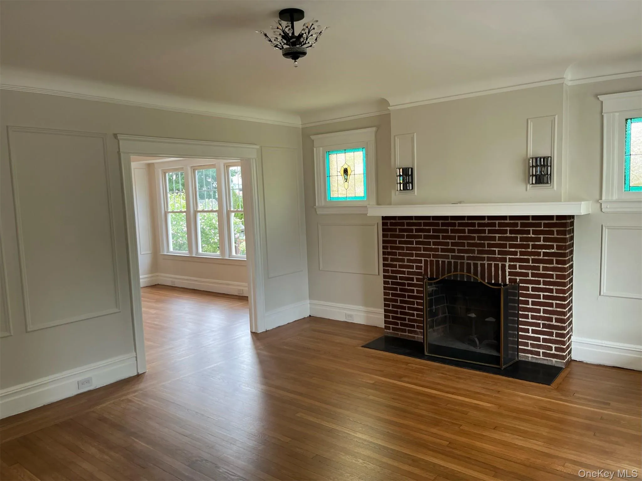 Unfurnished living room with plenty of natural light decorative fireplace Unfurnished living room with plenty of natural light decorative fireplace