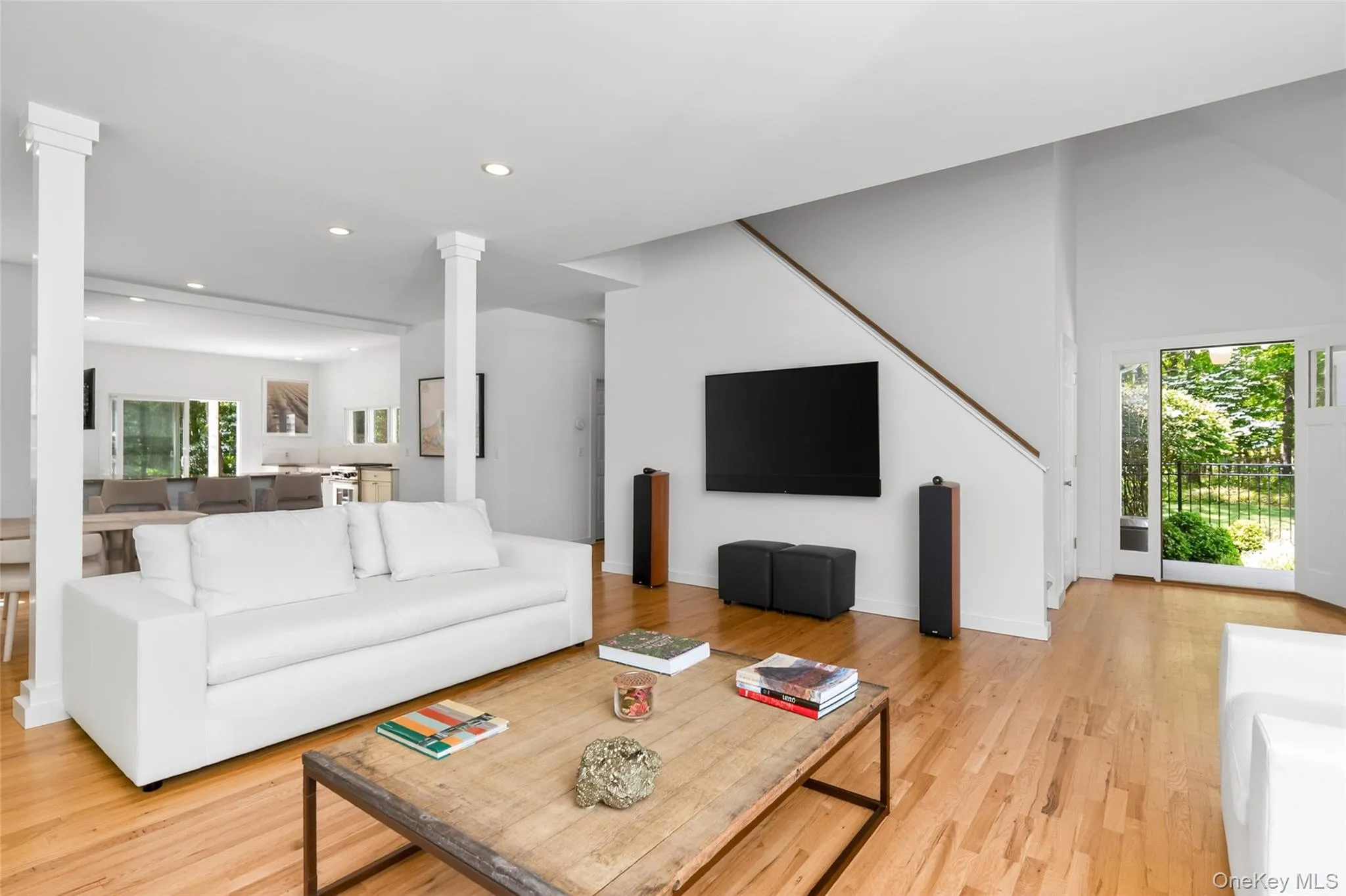 Hardwood flooring extends throughout this open-concept living space Hardwood flooring extends throughout this open-concept living space