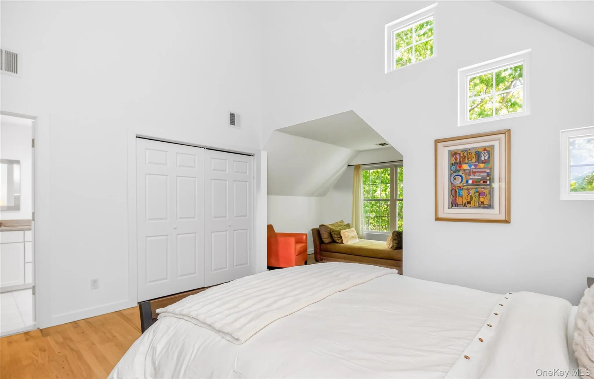 Vaulted white ceilings featuring upper-level rectangular windows Vaulted white ceilings featuring upper-level rectangular windows