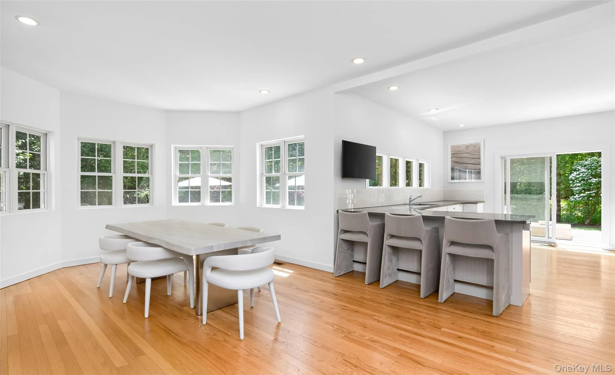 Hardwood flooring complements the bright, open-concept living space Hardwood flooring complements the bright, open-concept living space