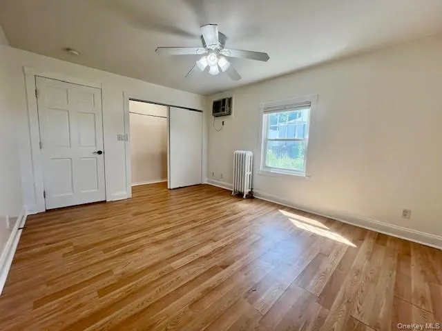 Spacious Primary Bedroom with HWF Spacious Primary Bedroom with HWF