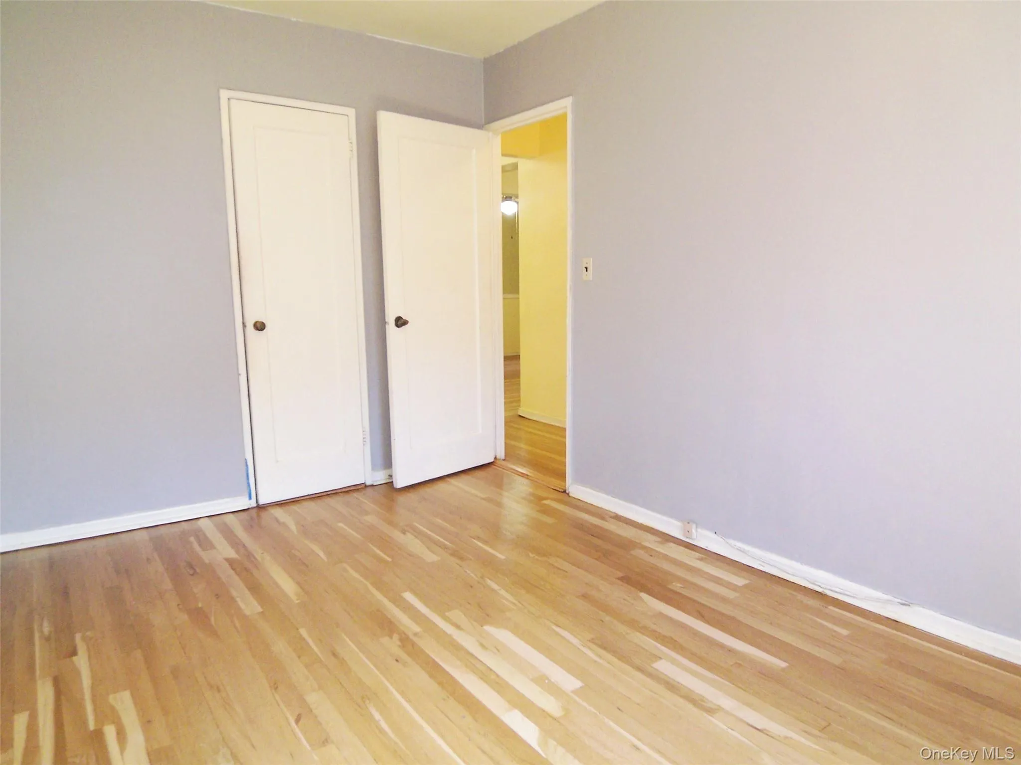 Light wood-finish flooring complements the light gray wall paint Light wood-finish flooring complements the light gray wall paint